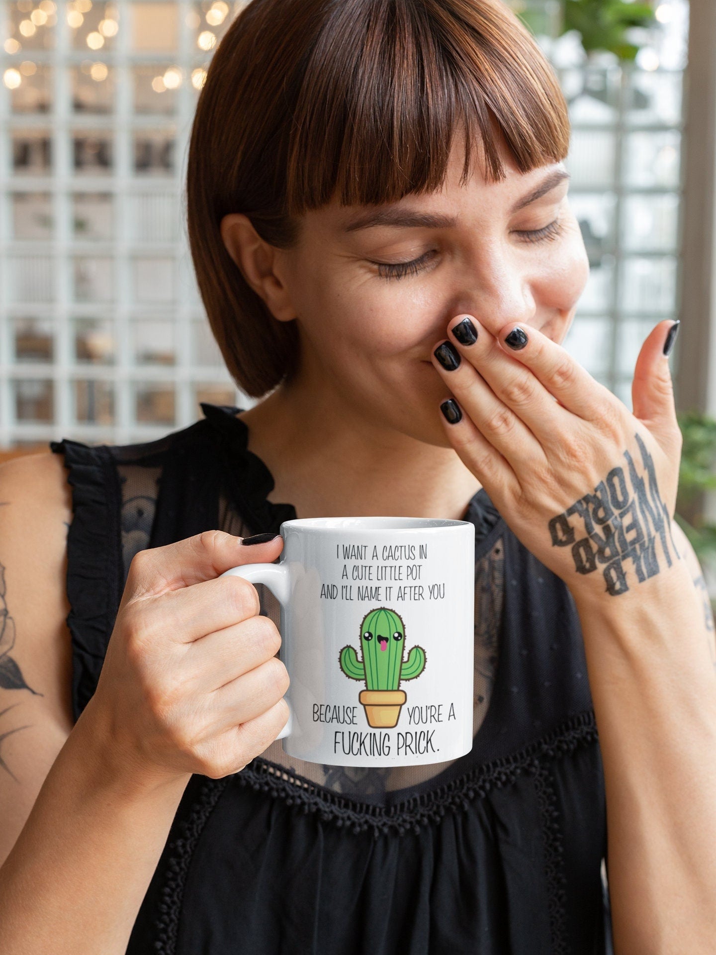 A white ceramic mug featuring a funny quote i want a cactus in a cute little pot & i'll name it after you because you're a fucking prick. Printed in black ink with a cute coloured cactus design underneath.