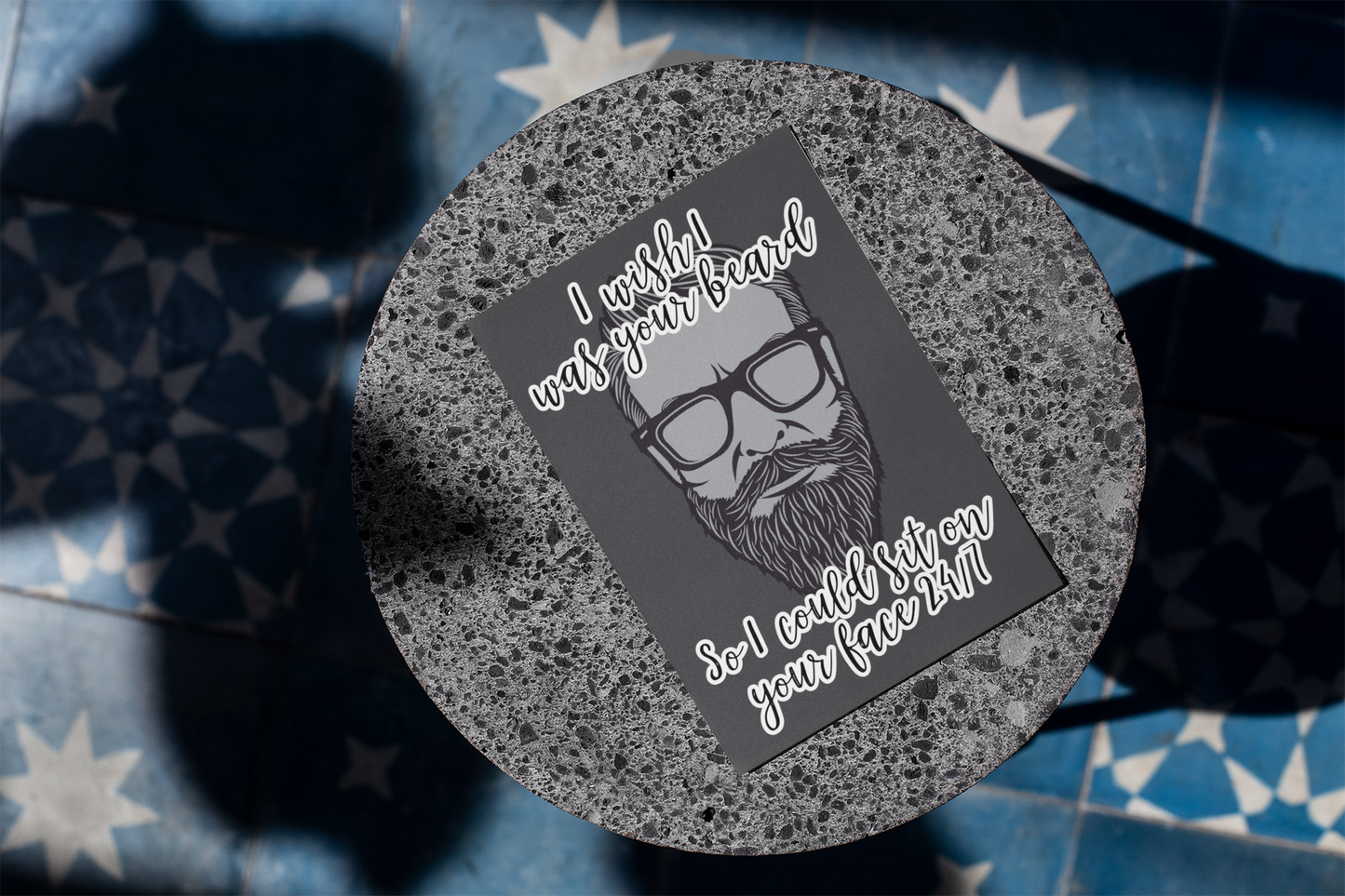 A black vertical card featuring a clipart of a beard. To the top is the quote 'i wish i was your beard' and to the bottom ' so i could sit on your face 24/7. Printed in white.