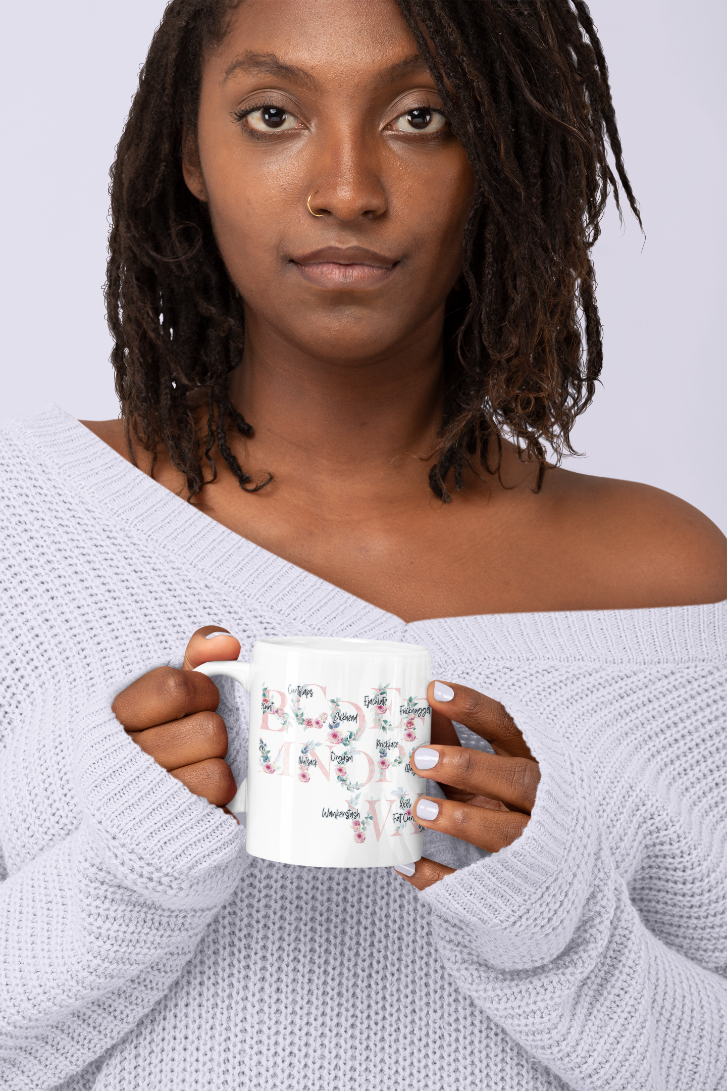 A white ceramic mug featuring a pink floral alphabet design around the whole of the mug. Each letter has a funny profanity word associated to it i.e, a for arseclown, b for bunglecunt.