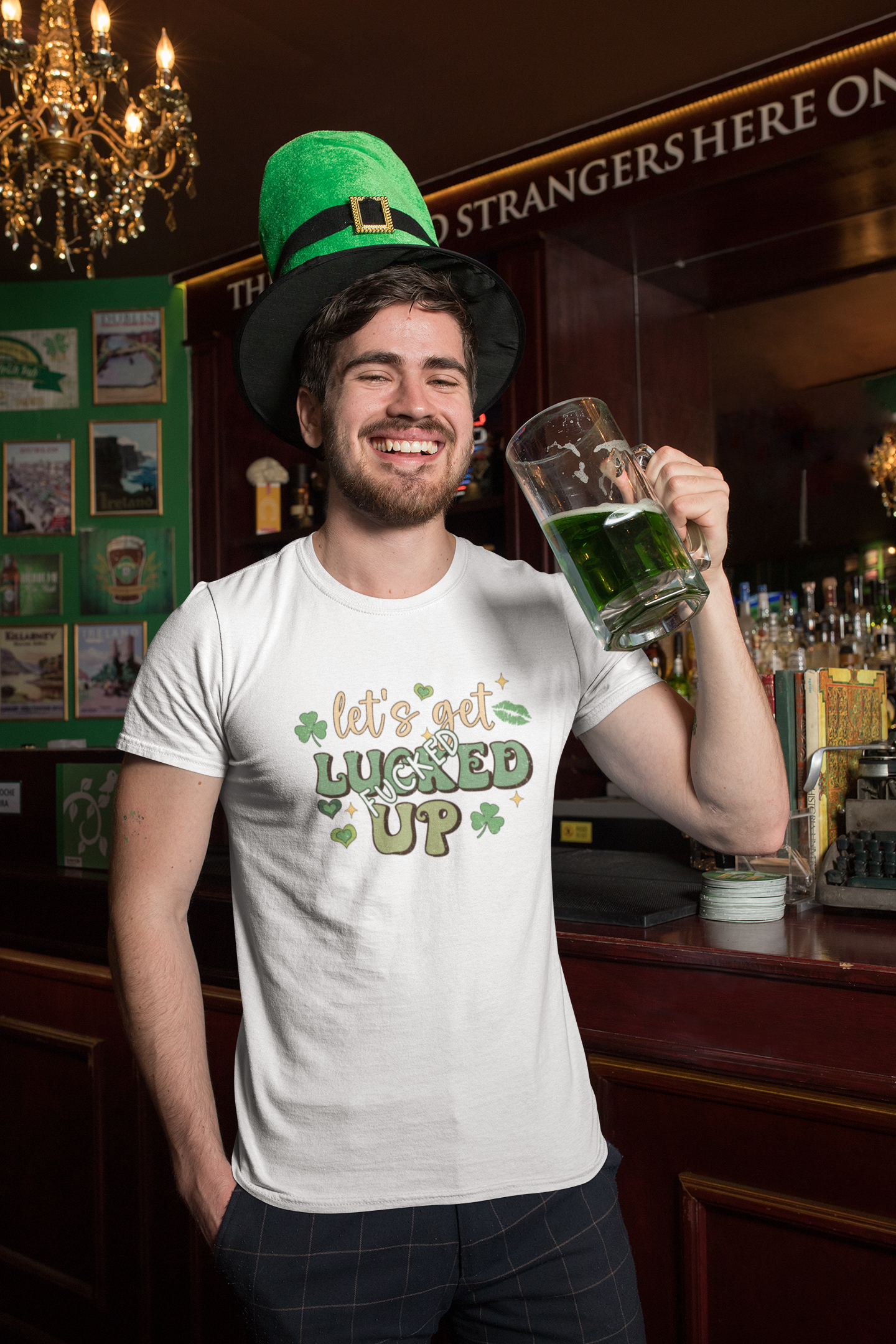 White tshirt with a St Patricks day logo to the front which reads 'let's get lucked up' with the word 'fucked' over the top of the word luck. In bold green colours with clovers surrounding the design.