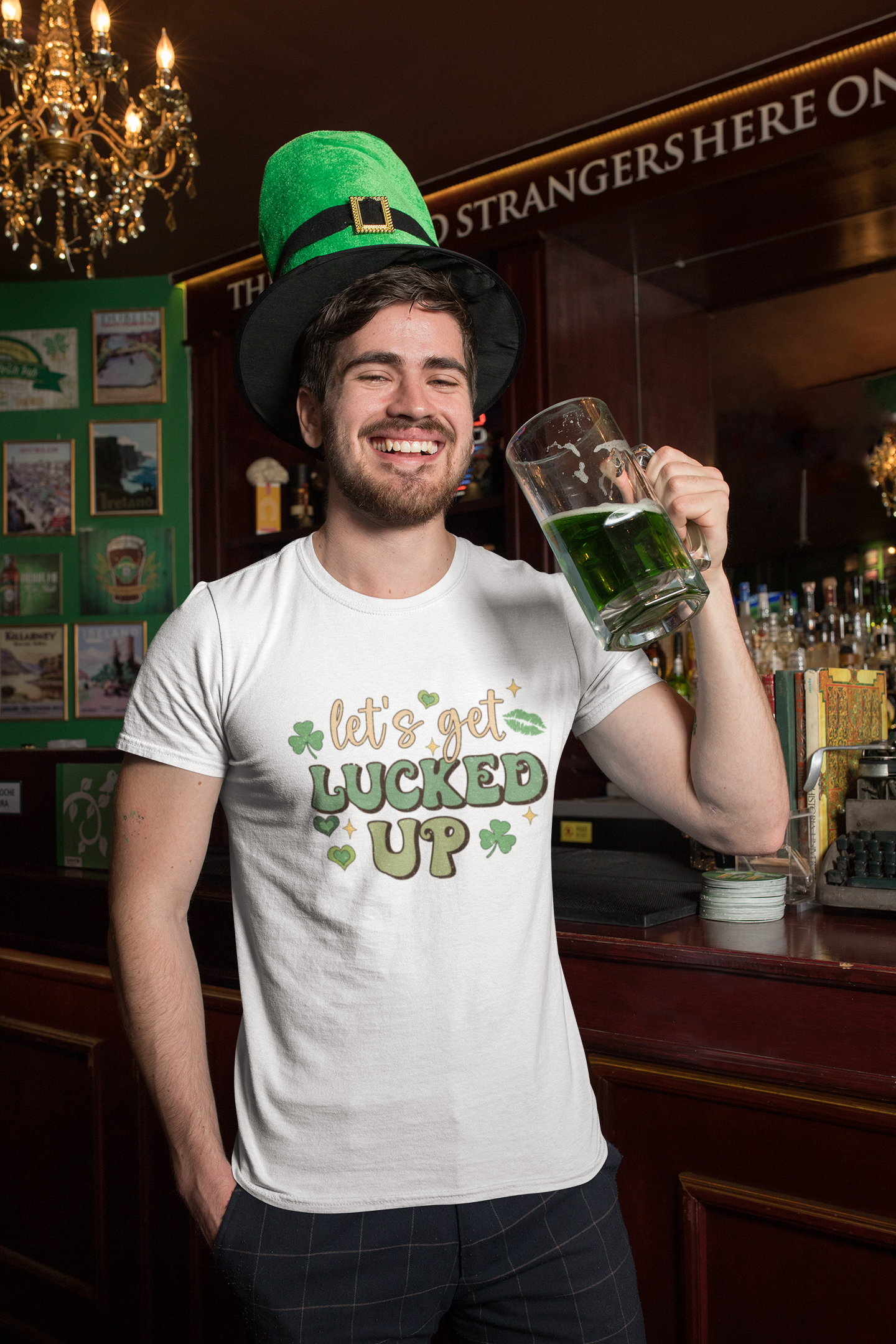 White tshirt with a St Patricks day logo to the front which reads 'let's get lucked up' with the word 'fucked' over the top of the word luck. In bold green colours with clovers surrounding the design.