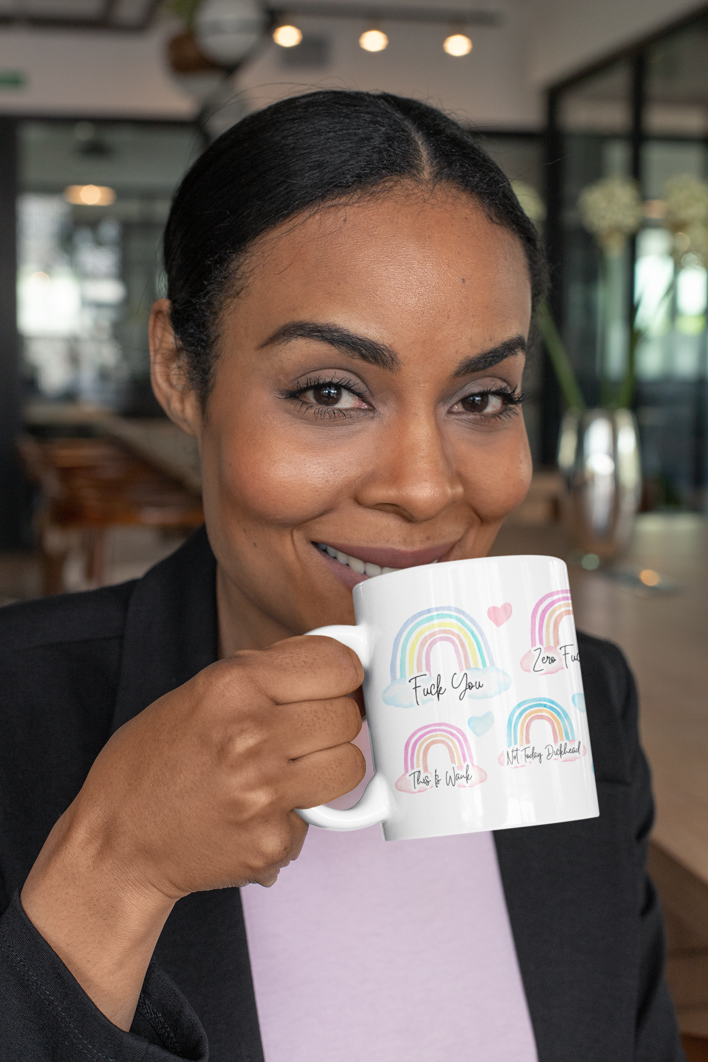 White mug featuring colourful watercolour rainbows. Over each one is a funny profanity quote such as 'no fucks club, not today dickhead & fuck off'. 