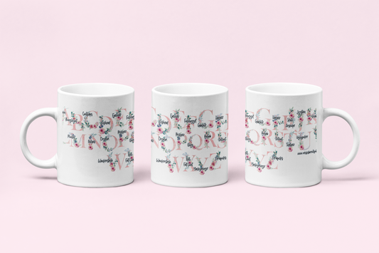 A white ceramic mug featuring a pink floral alphabet design around the whole of the mug. Each letter has a funny profanity word associated to it i.e, a for arseclown, b for bunglecunt.