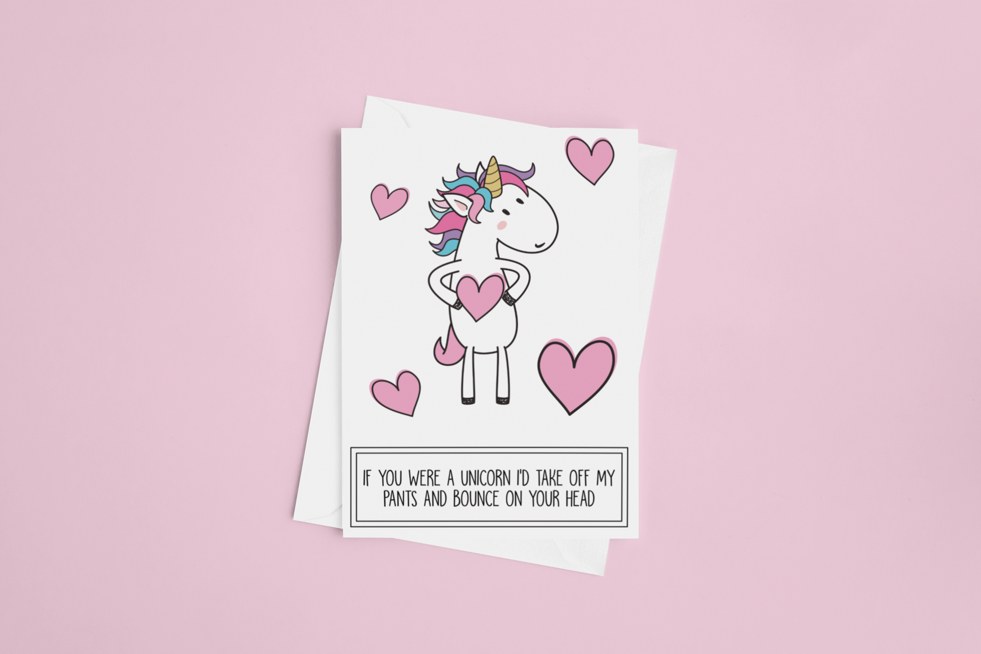 White vertical greetings card featuring a fun unicorn design. To the botton it reads 'if you were a unicorn, i'd take off my pants & bounce on your head'. Printed in black ink.