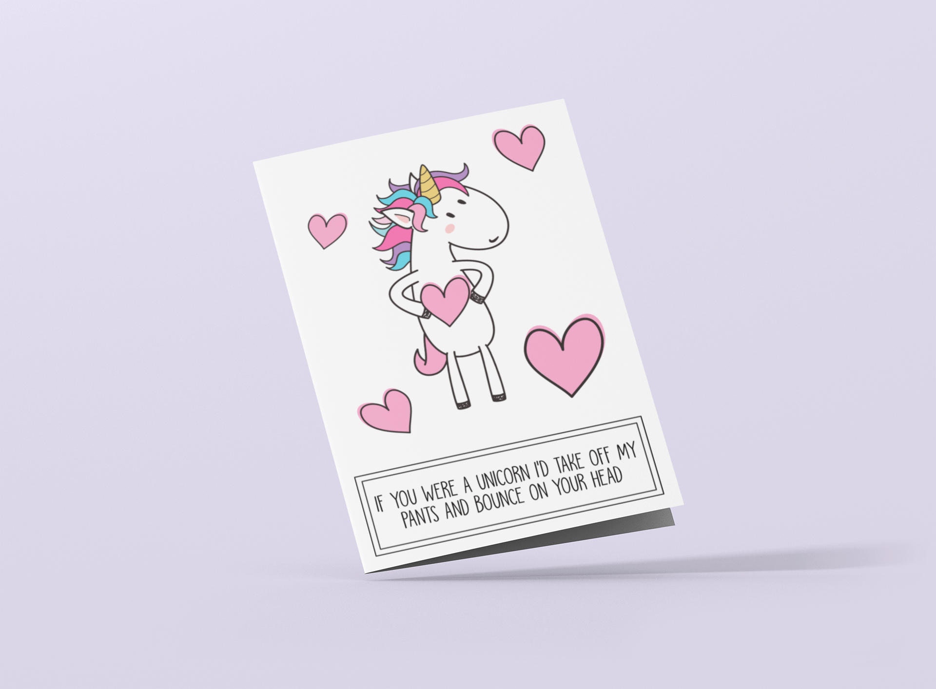 White vertical greetings card featuring a fun unicorn design. To the botton it reads 'if you were a unicorn, i'd take off my pants & bounce on your head'. Printed in black ink.