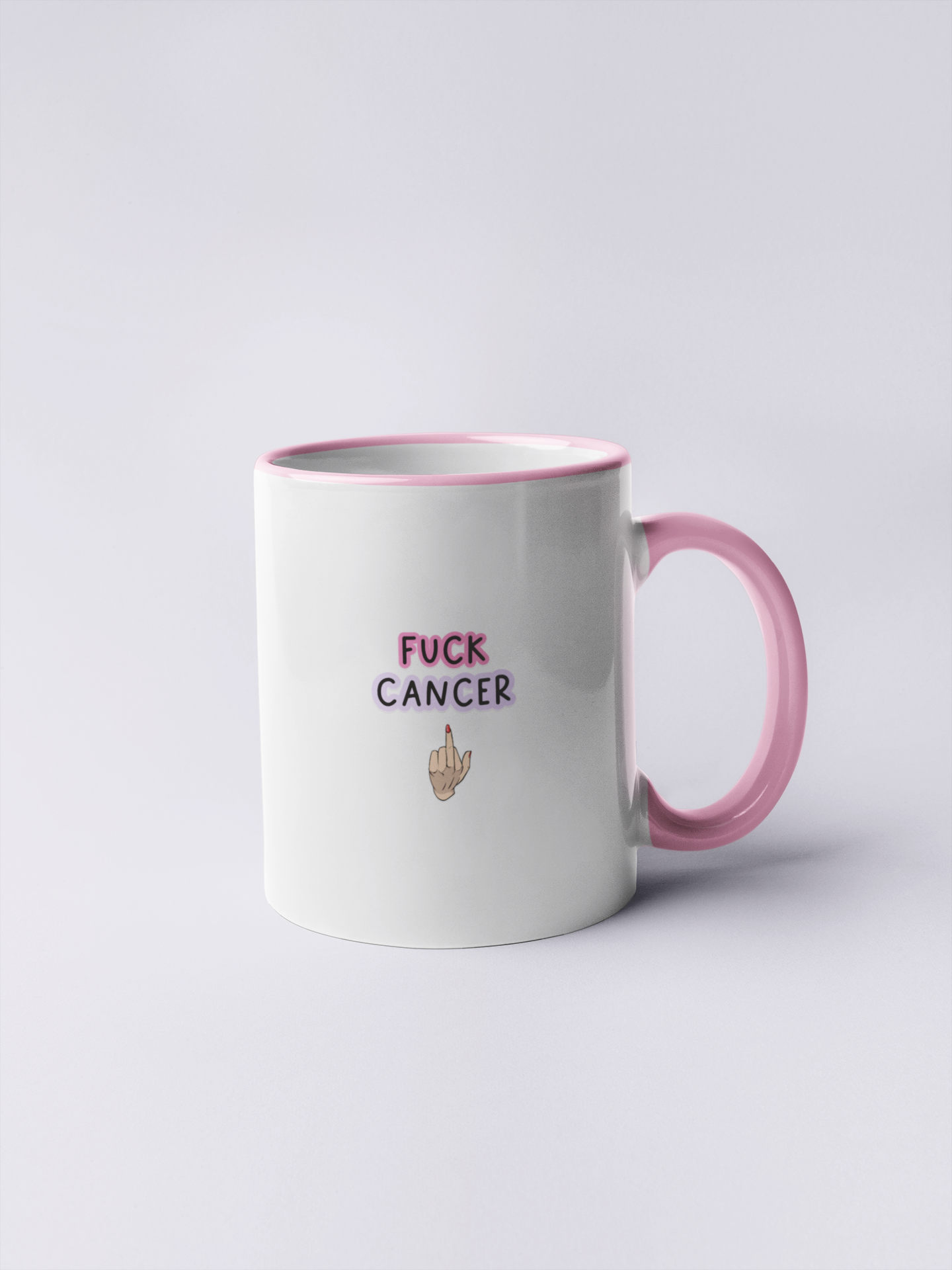 White mug with a pink inner & rim with a middle finger clipart in the centre. Above the middle finger design is the words 'fuck cancer', printed in black with a pink & purple outline.