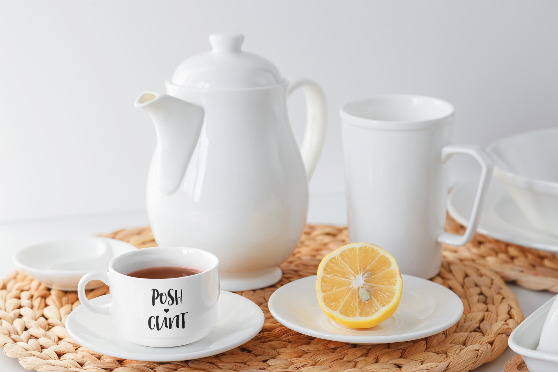 White tea cup & saucer set with the quote posh c*nt to the front with a little heart, in black.