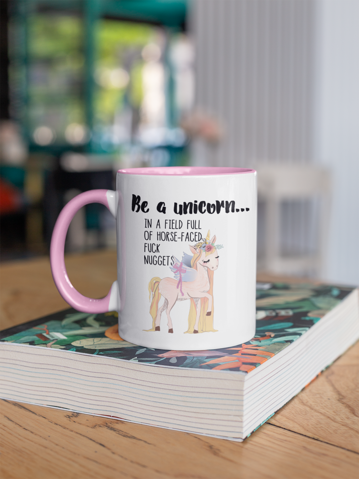 A white ceramic mug with a pink handle & inner featuring a funny quote be a unicorn... In a field full of horsefaced, fucknuggets Printed in black ink with a cute pastel coloured unicorn underneath.