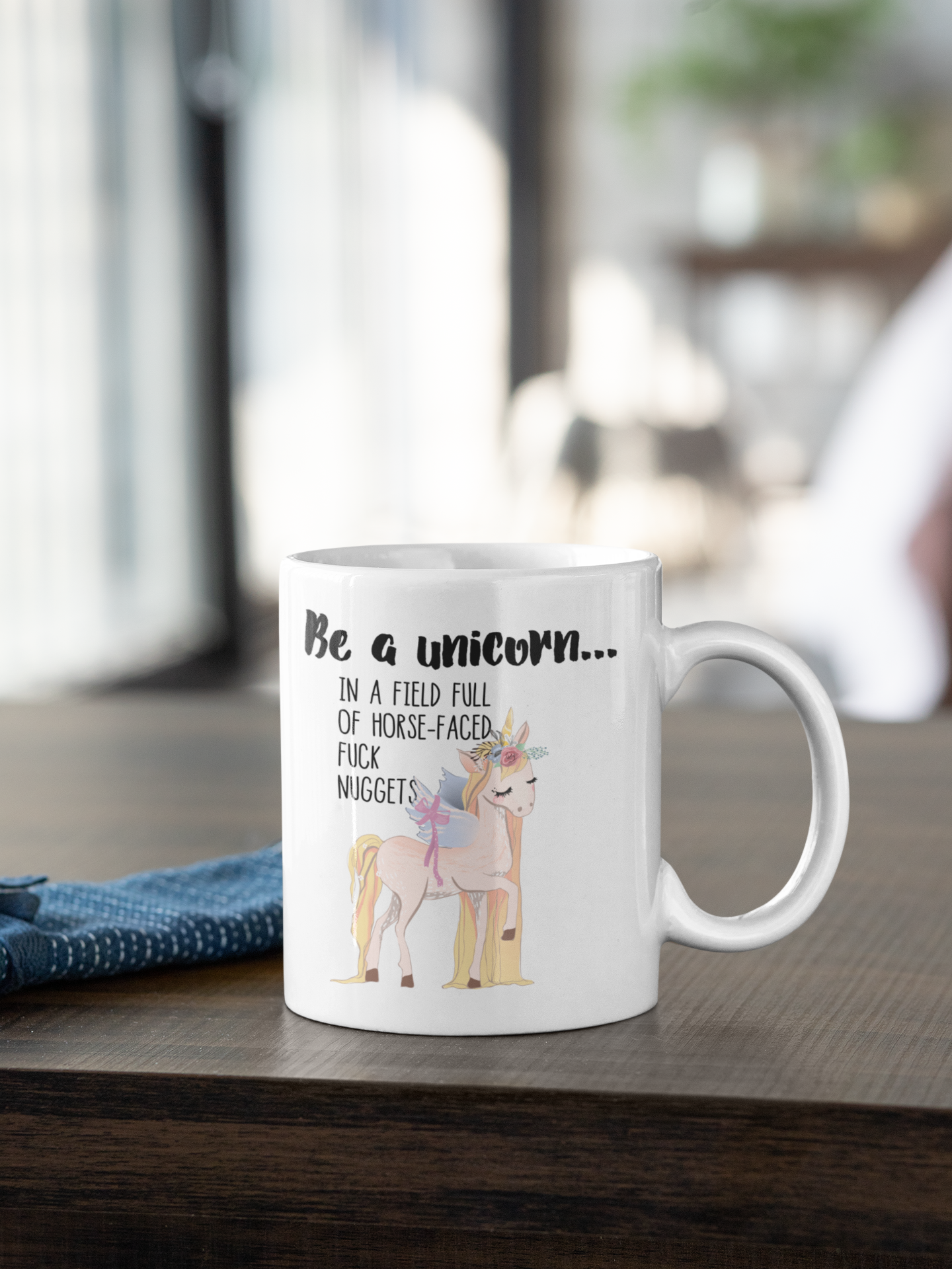 A white ceramic mug featuring a funny quote be a unicorn... In a field full of horsefaced, fucknuggets Printed in black ink with a cute pastel coloured unicorn underneath.