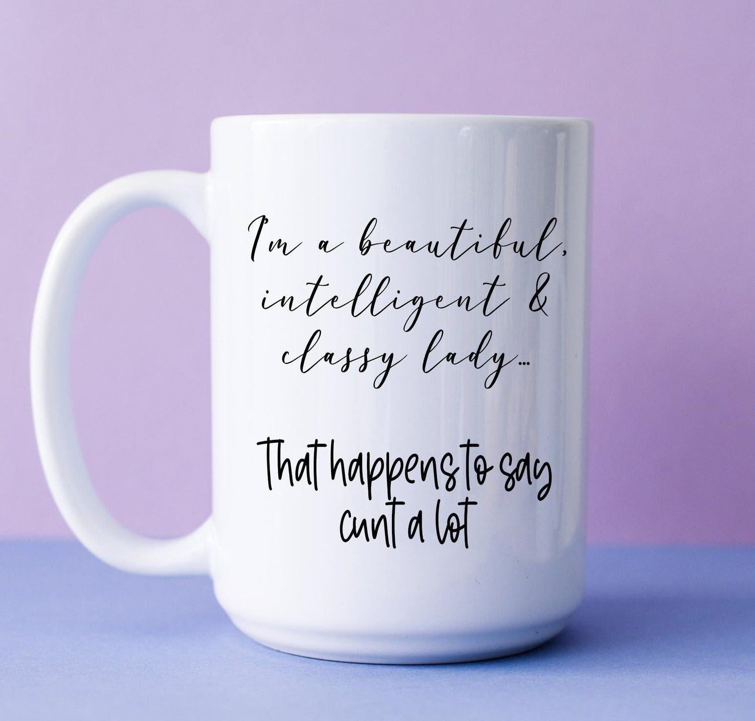 White mug featuring the funny quote i'm a beautiful, intelligent & classy lady... that happens to say c*nt a lot. Printed in black ink.
