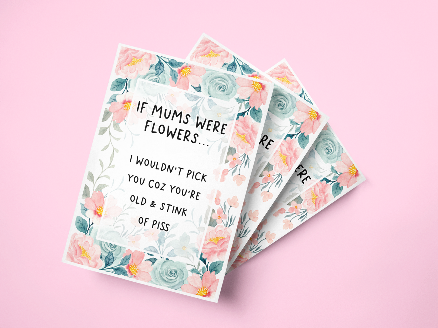 Notebook with a pastel colour floral design to the front with the quote 'if mums were flowers... i wouldn't pick you coz you're old & stink of piss' printed in the middle in black ink.