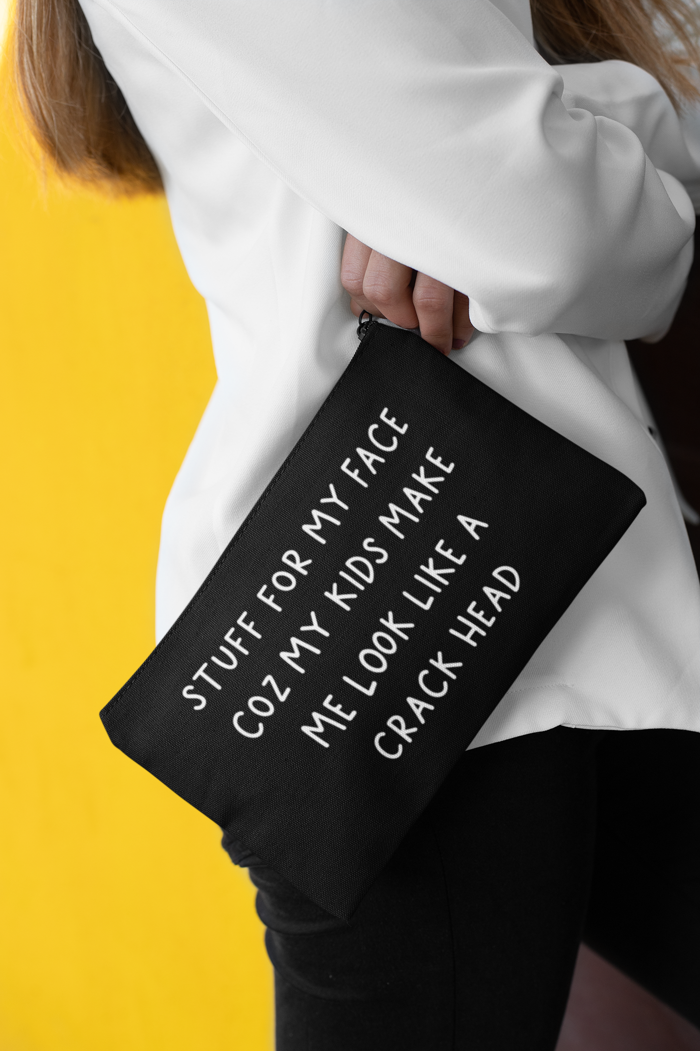 Black canvas make up bag with white lettering to the front featuring the funny quote 'stuff for my face coz my kids make me look like a crack head'. 