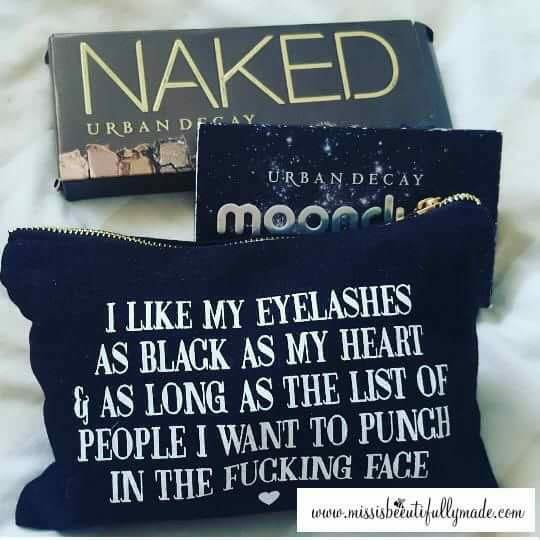 Black cosmetic bag featuring a funny quote in a bold text which reads 'i like my eyelashes as black as my heart & as long as the list of people i want to punch in the fucking face.' Printed in white.