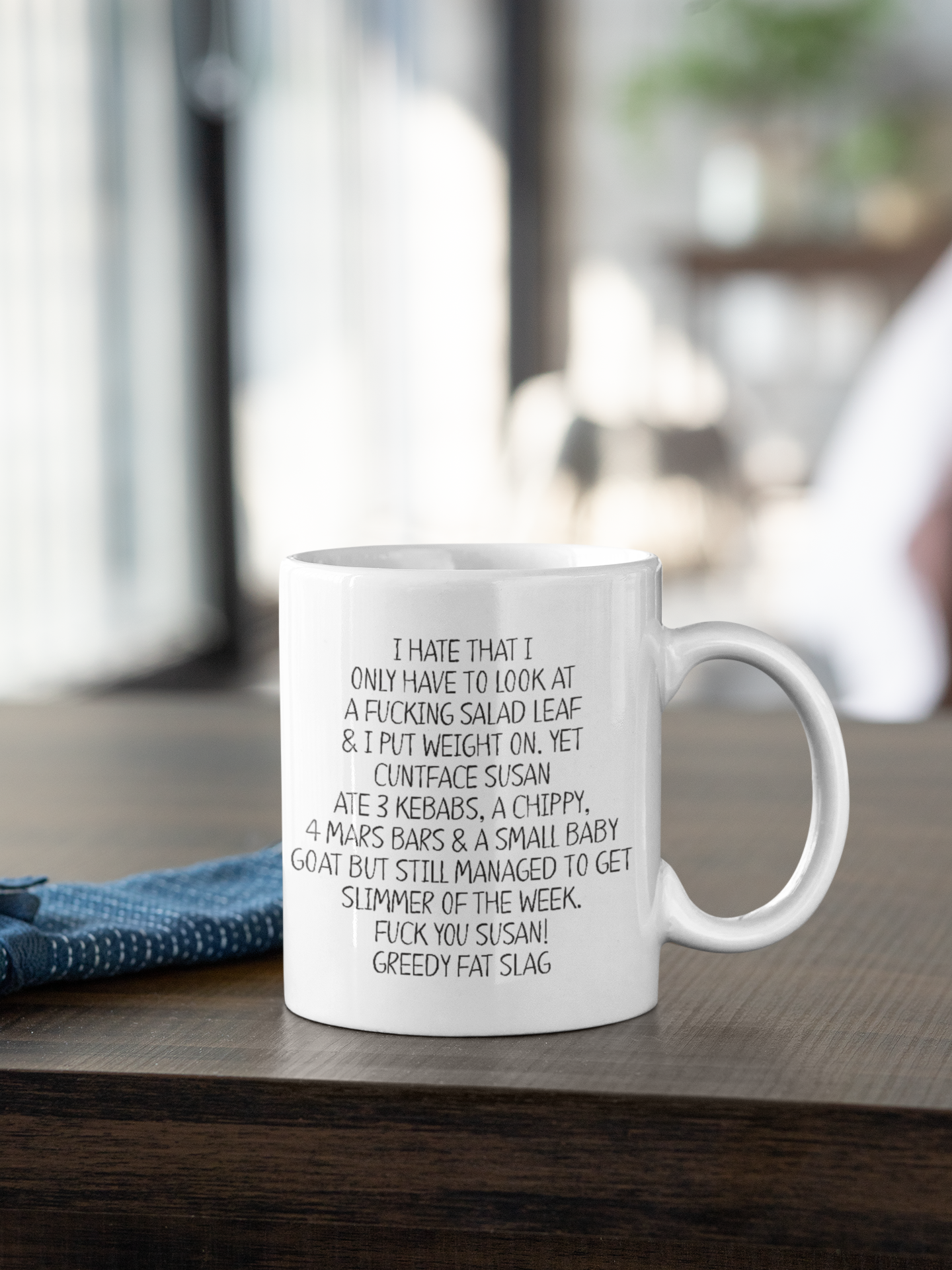 Very funny white ceramic mug with a quote printed to the front I hate that I only have to look at a fucking salad leaf and put weight on followed by more profanity references about weight gain and diet clubs.