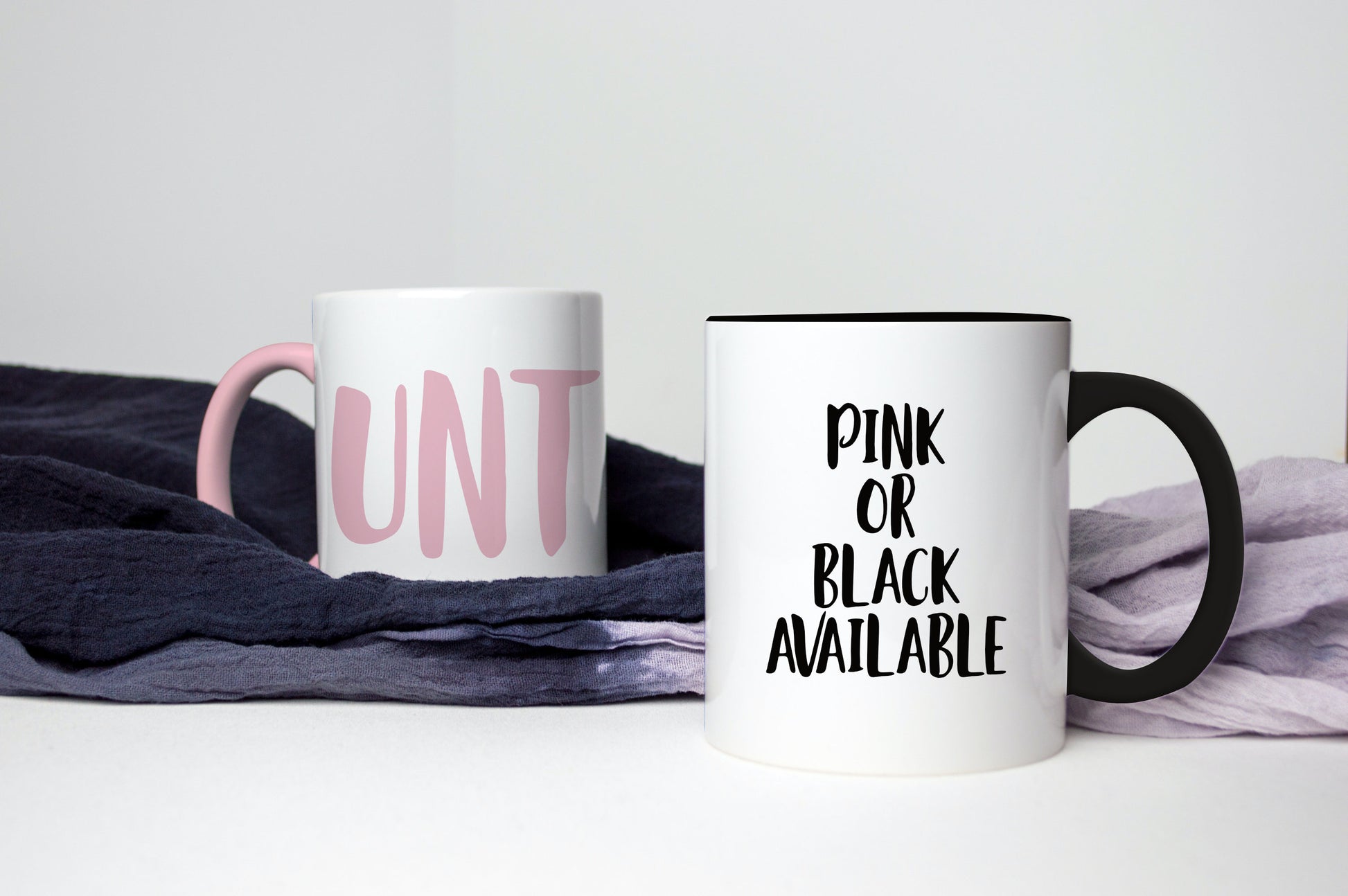 A white ceramic mug with a black handle featuring a funny profanity quote to the front UNT, printed in black ink.
