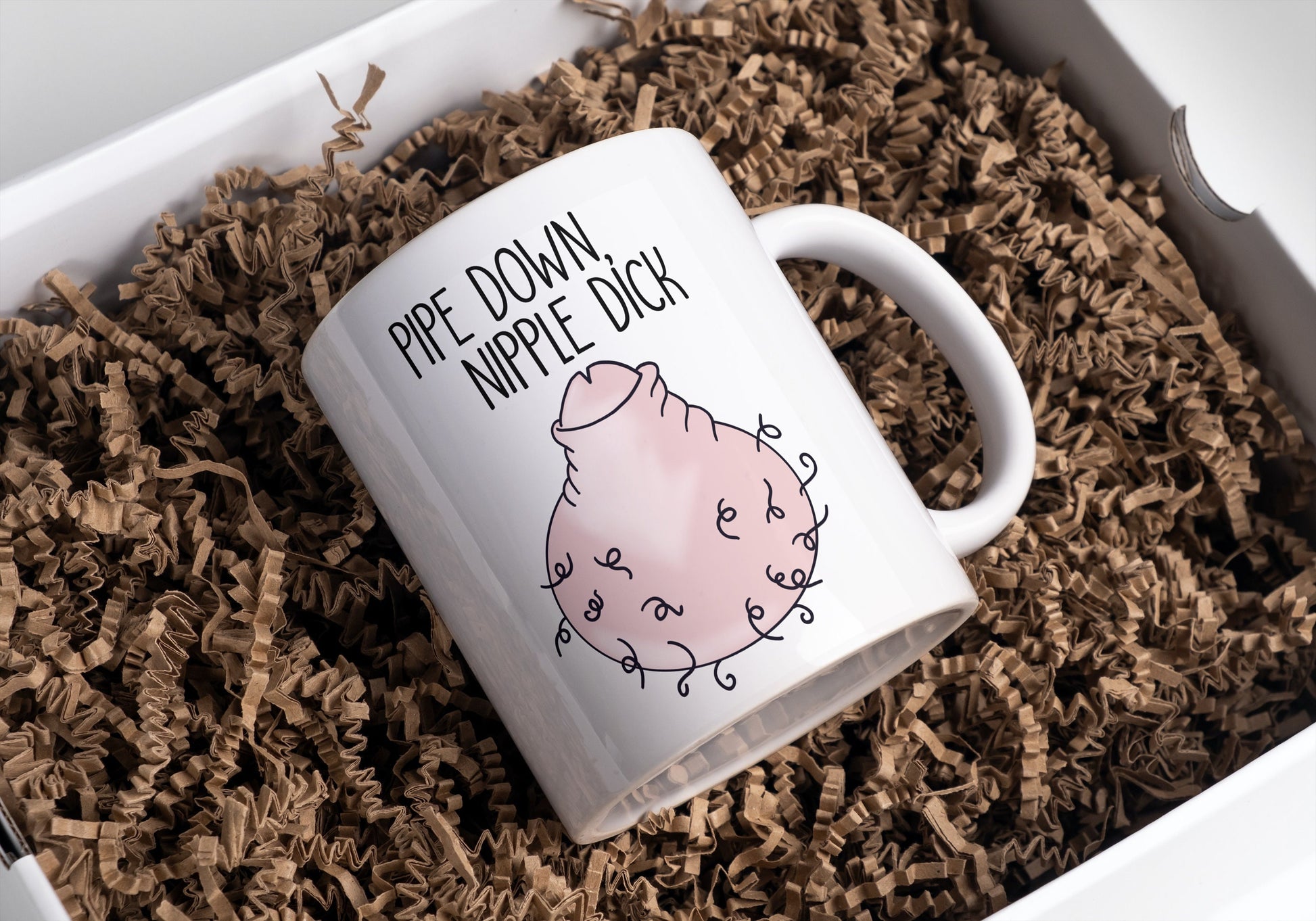 White ceramic mug featuring a fun colourful willy drawing to the front. Features a funny quote 'pipe down nipple dick' in black ink.