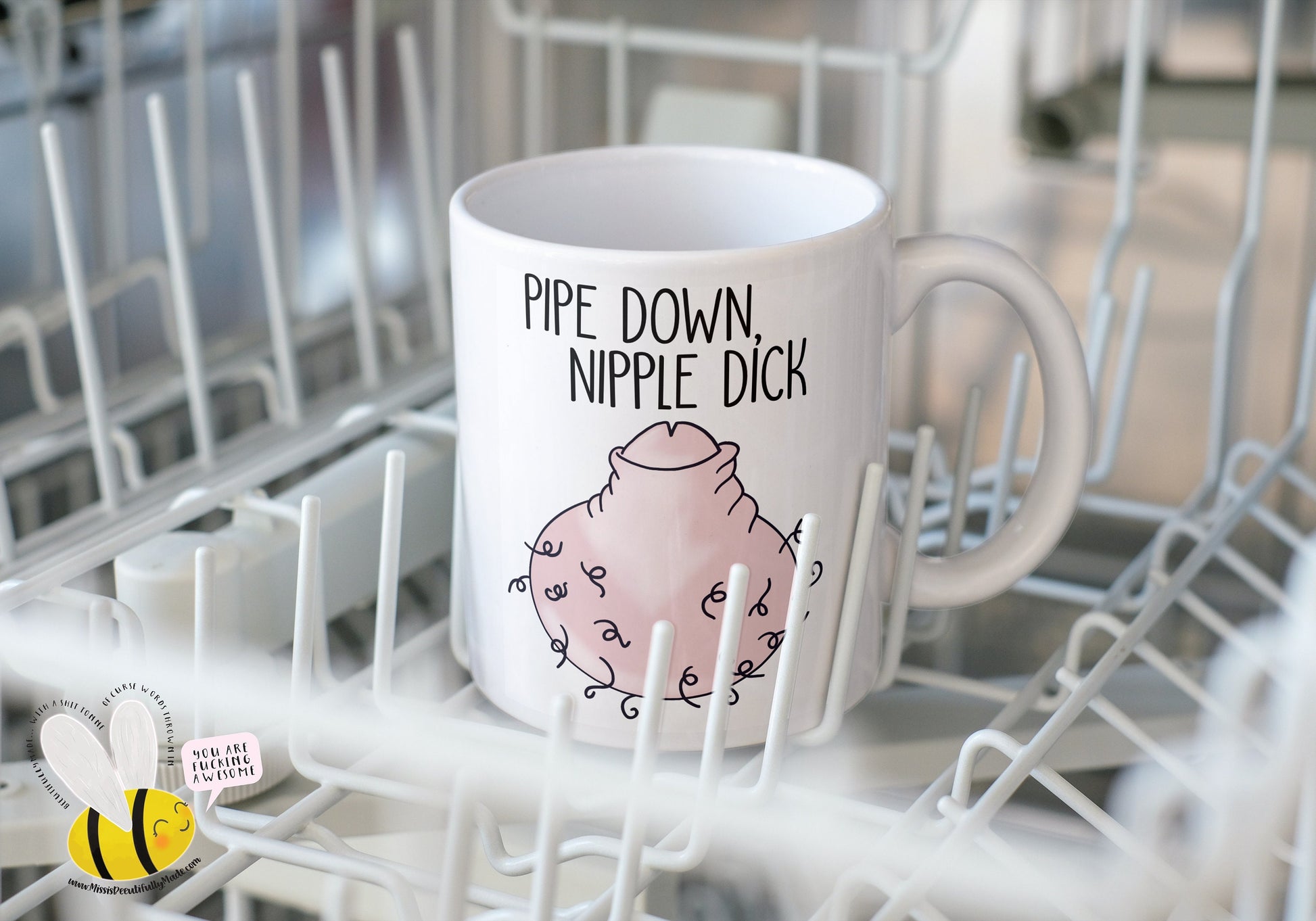 White ceramic mug featuring a fun colourful willy drawing to the front. Features a funny quote 'pipe down nipple dick' in black ink.