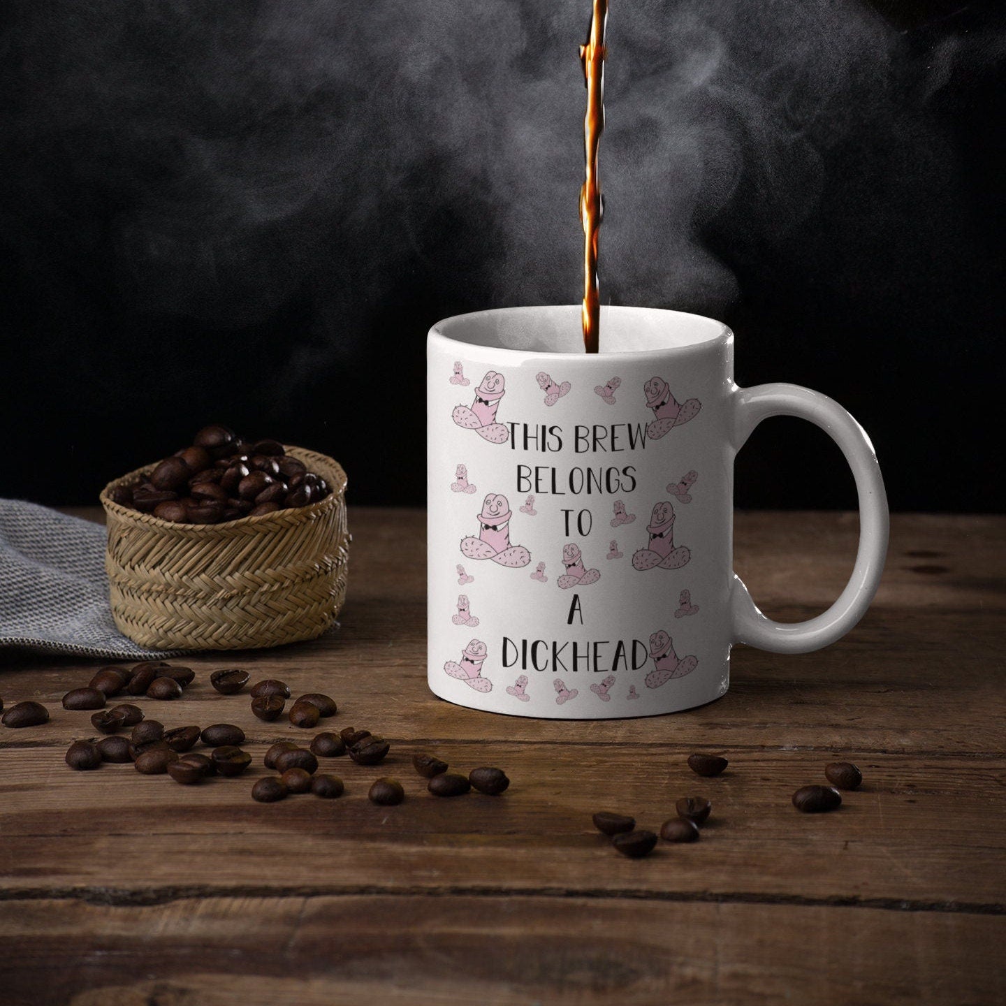 White ceramic mug with a funny penis design printed to the front. Includes the quote 'this brew belongs to a dickhead'. Printed in black ink.