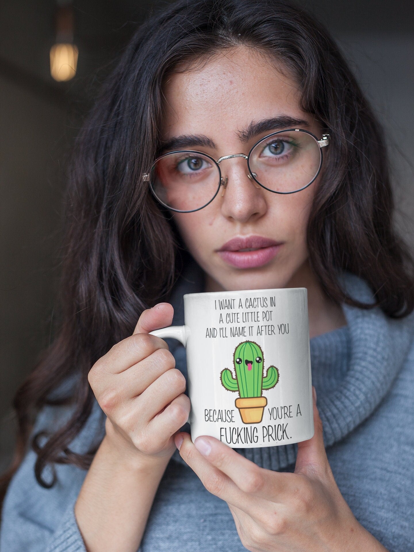 A white ceramic mug featuring a funny quote i want a cactus in a cute little pot & i'll name it after you because you're a fucking prick. Printed in black ink with a cute coloured cactus design underneath.