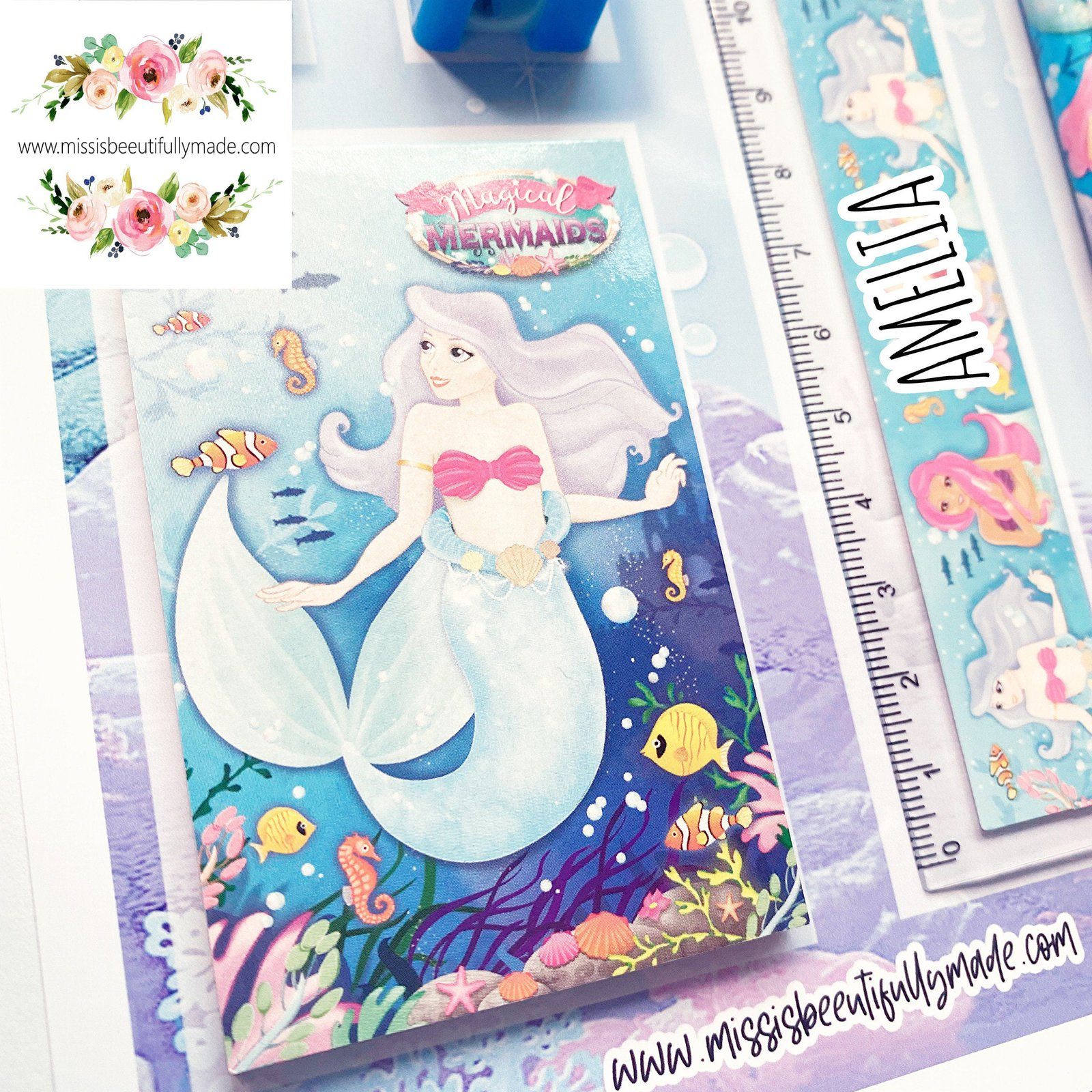 Personalised Children's stationery set in a mermaid, under the sea design. The contents are, rubber, sharpener, notepad, ruler & pencil. All complete on a personalised backing card. The ruler is also personalised with Childs name.
