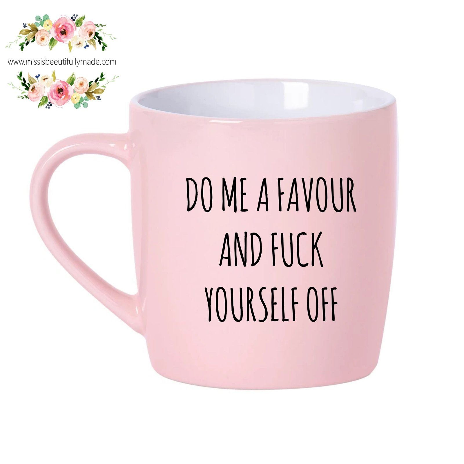 Pink cermaic mug with the quote 'do me a favour & fuck yourself off' to the front in black text.