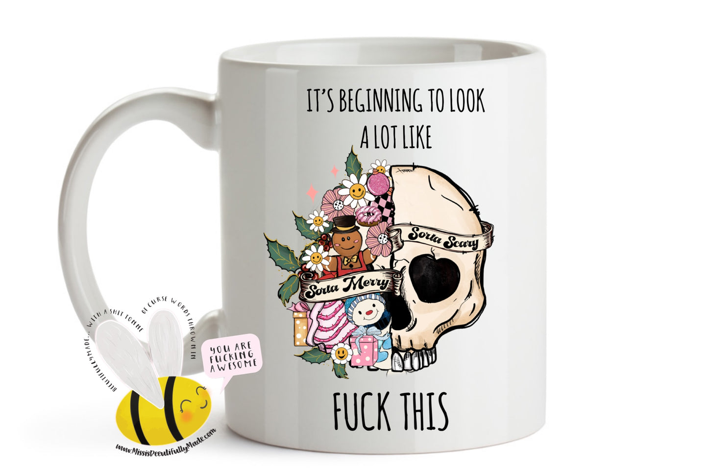 White mug with a fun floral christmas skull design with the words it's beginning to look a lot at the top and to the bottom it reads fuck this. Printed in black ink.