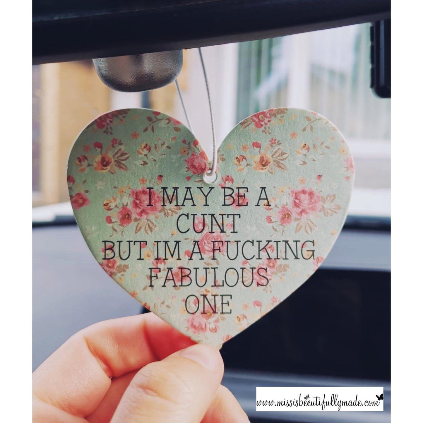 Unscented heart shape car freshener with a mint and pink floral design. Printed front & back with the quote 'I may be a cunt but i'm a fucking fabulous one'. Add your own scent