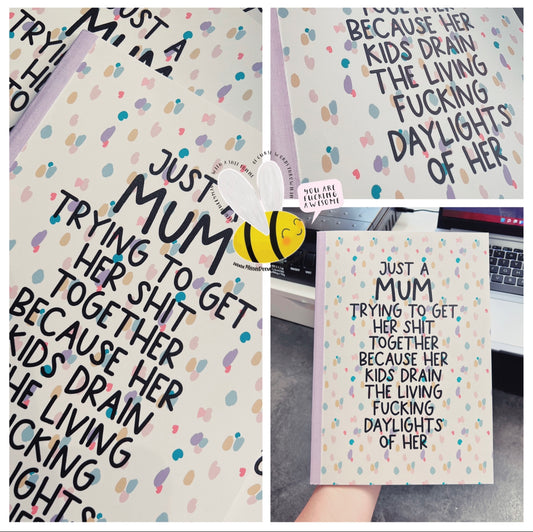 Pastel lilac colour notebook with the funny quote 'just a mum trying to get her shit together because her kids drain the living fucking daylights of her'.