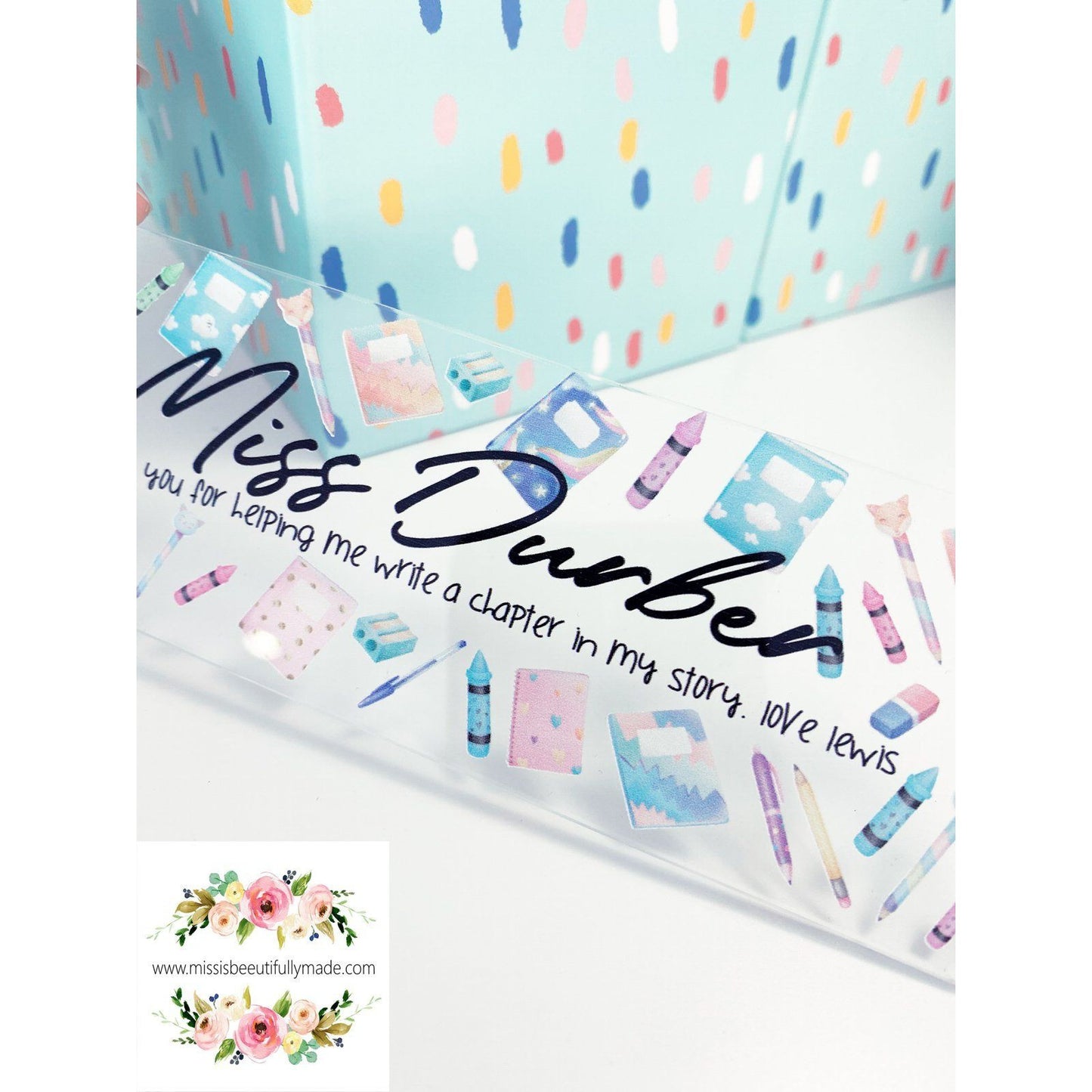 Clear Acrylic bookmark, personalised with child's and teachers name. Has a beautiful stationery design to the front and a white tassel to finish it off. Printed direct to the acrylic.