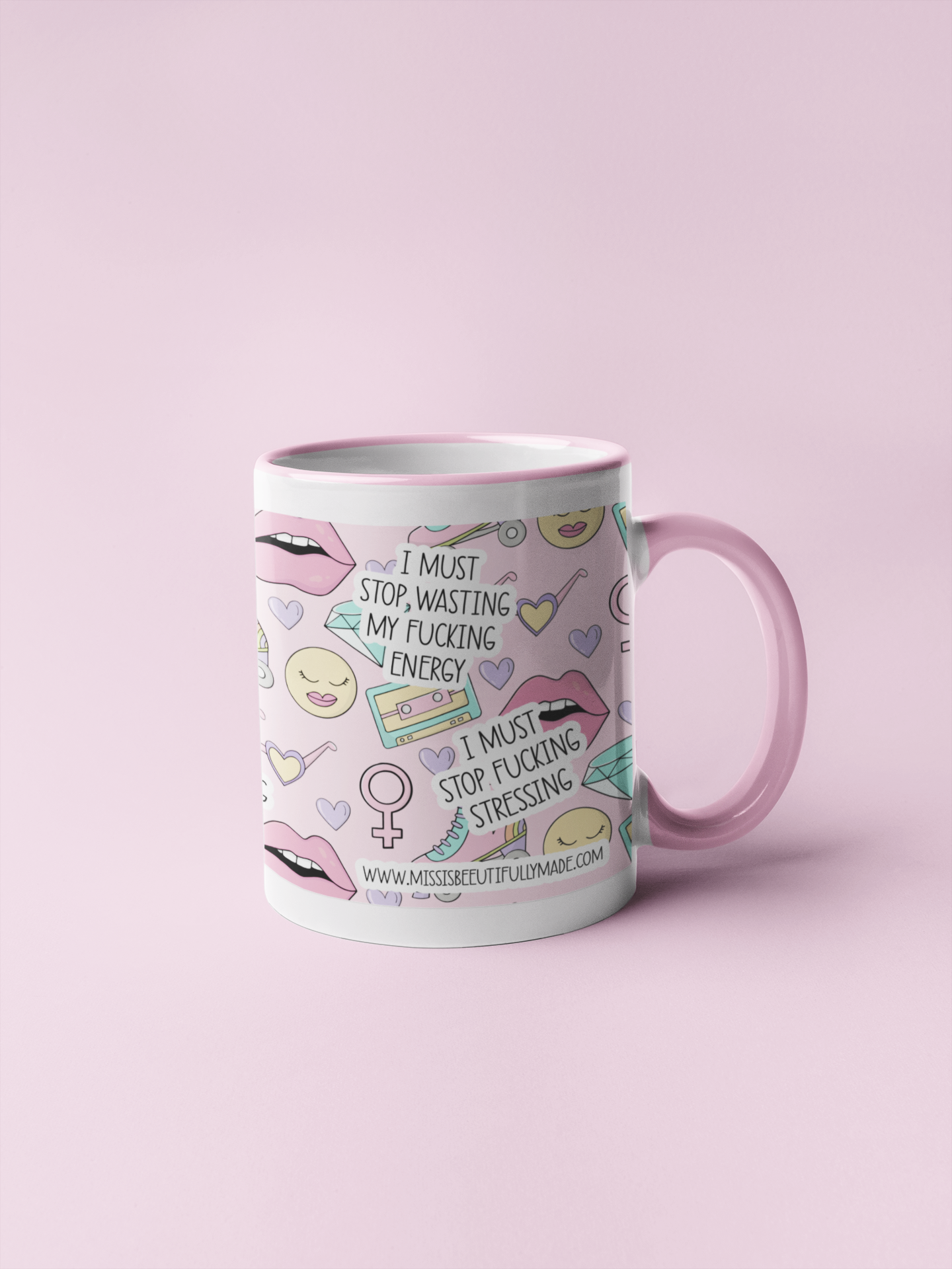 White ceramic mug with a pink printed retro design. Funny I must affirmation quotes are printed around the whole mug i.e I must continue to fucking swear and i must tell more people to fuck off.