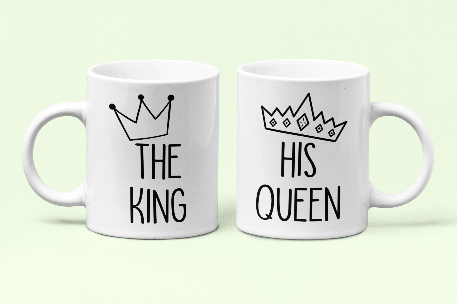 White mugs with the quotes the king & his queen with a cartoon crown printed to the top.