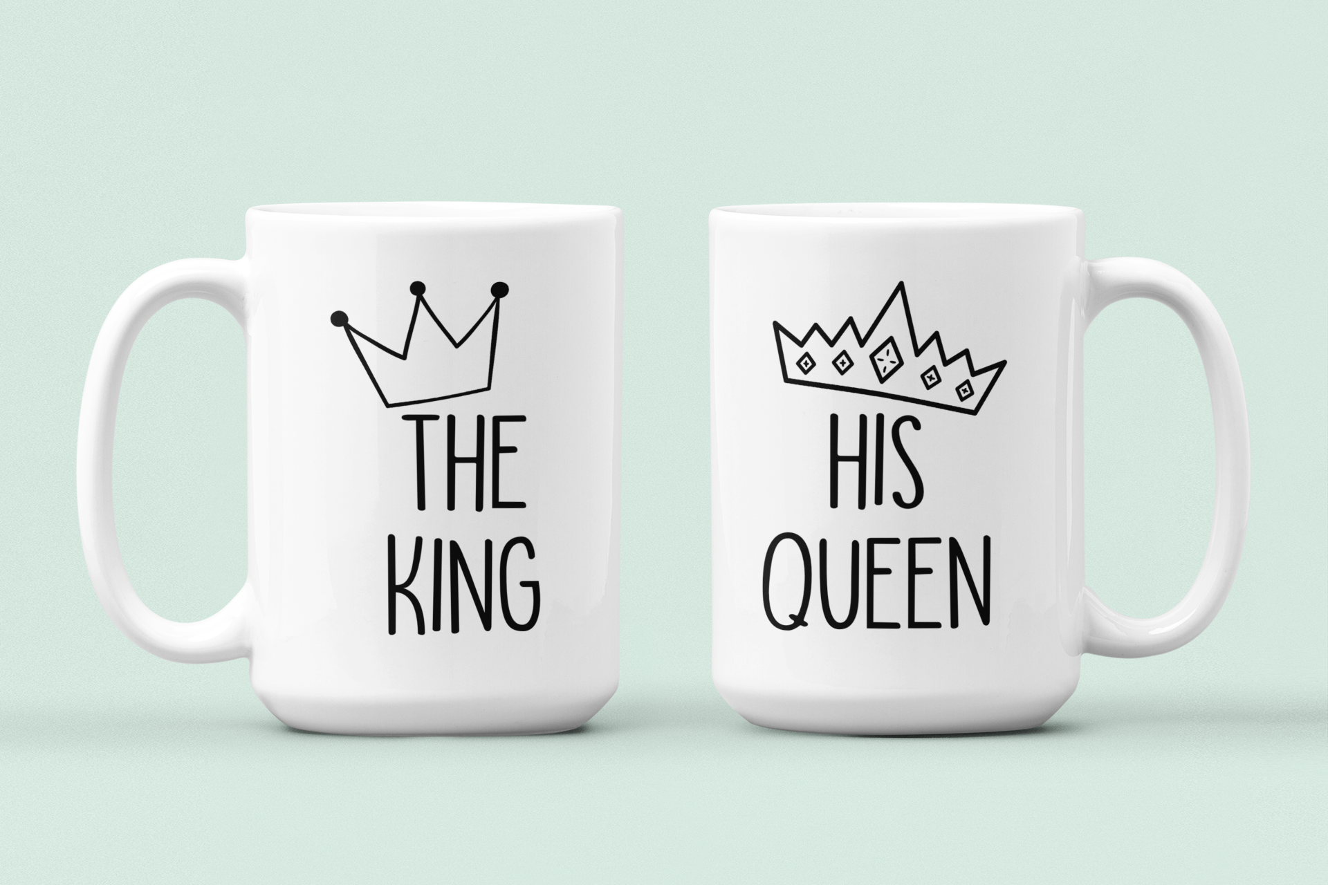 White mugs with the quotes the king & his queen with a cartoon crown printed to the top.