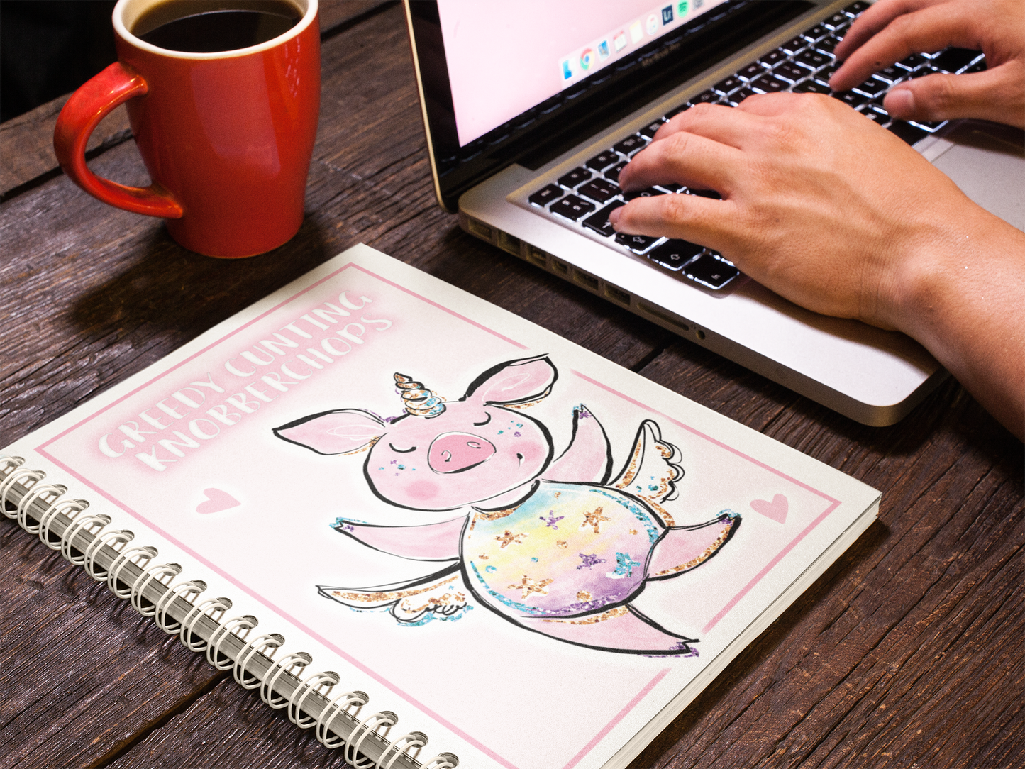 A5 food diary with daily food log pages containing sections for snacks, exercise & water intake. The cover features a fun pink design with a unicorn pig & a quote to the top which reads 'greedy cunting knobberchops'. 