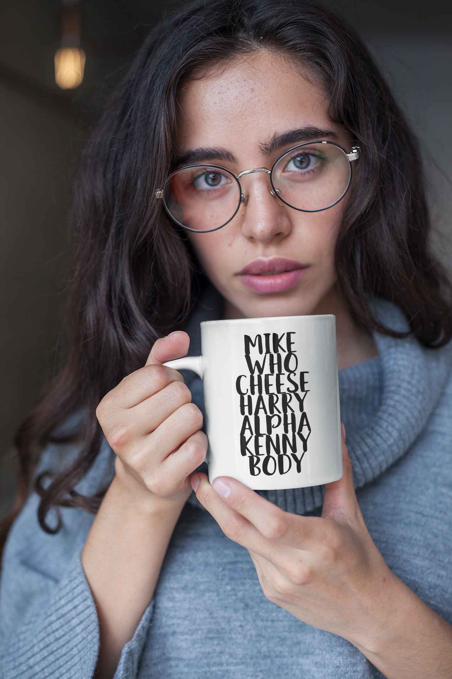 White mug with the quote mike who cheese alpha kenny body printed down the middle in black ink.