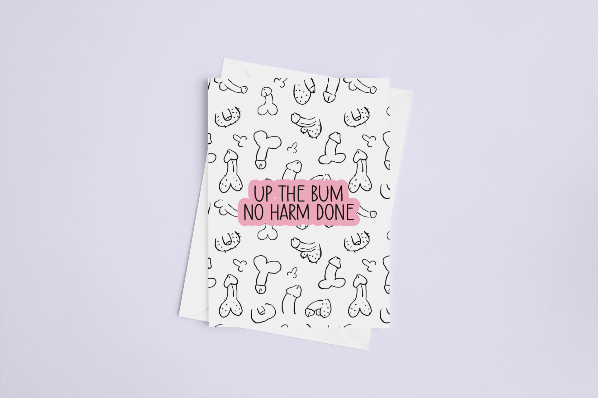 A white folded greetings card & envelope featuring a fun willy design print to the front. Over the print is a funny quote 'up the bum, no harm done', printed in black & pink ink