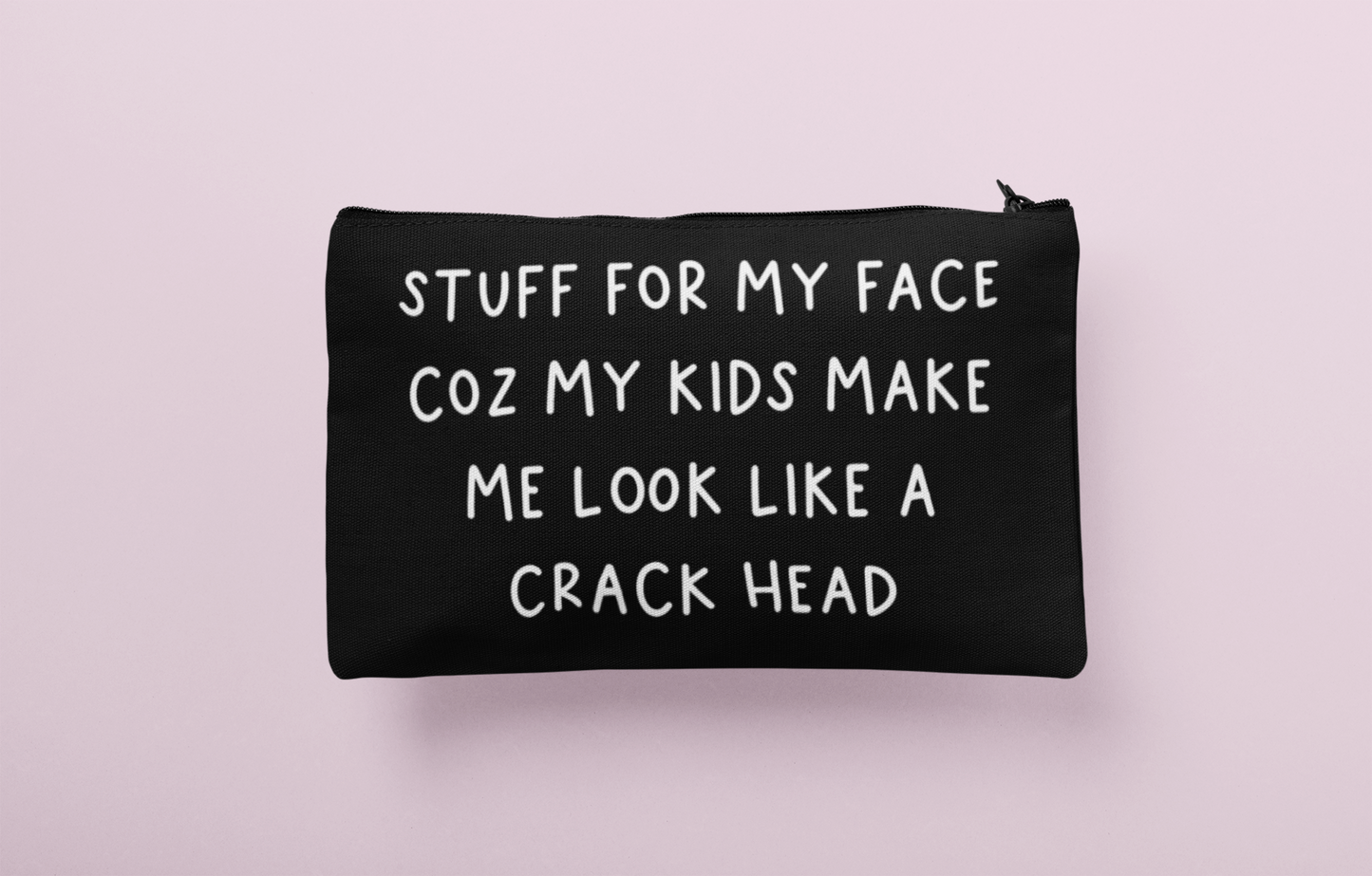 Black canvas make up bag with white lettering to the front featuring the funny quote 'stuff for my face coz my kids make me look like a crack head'. 