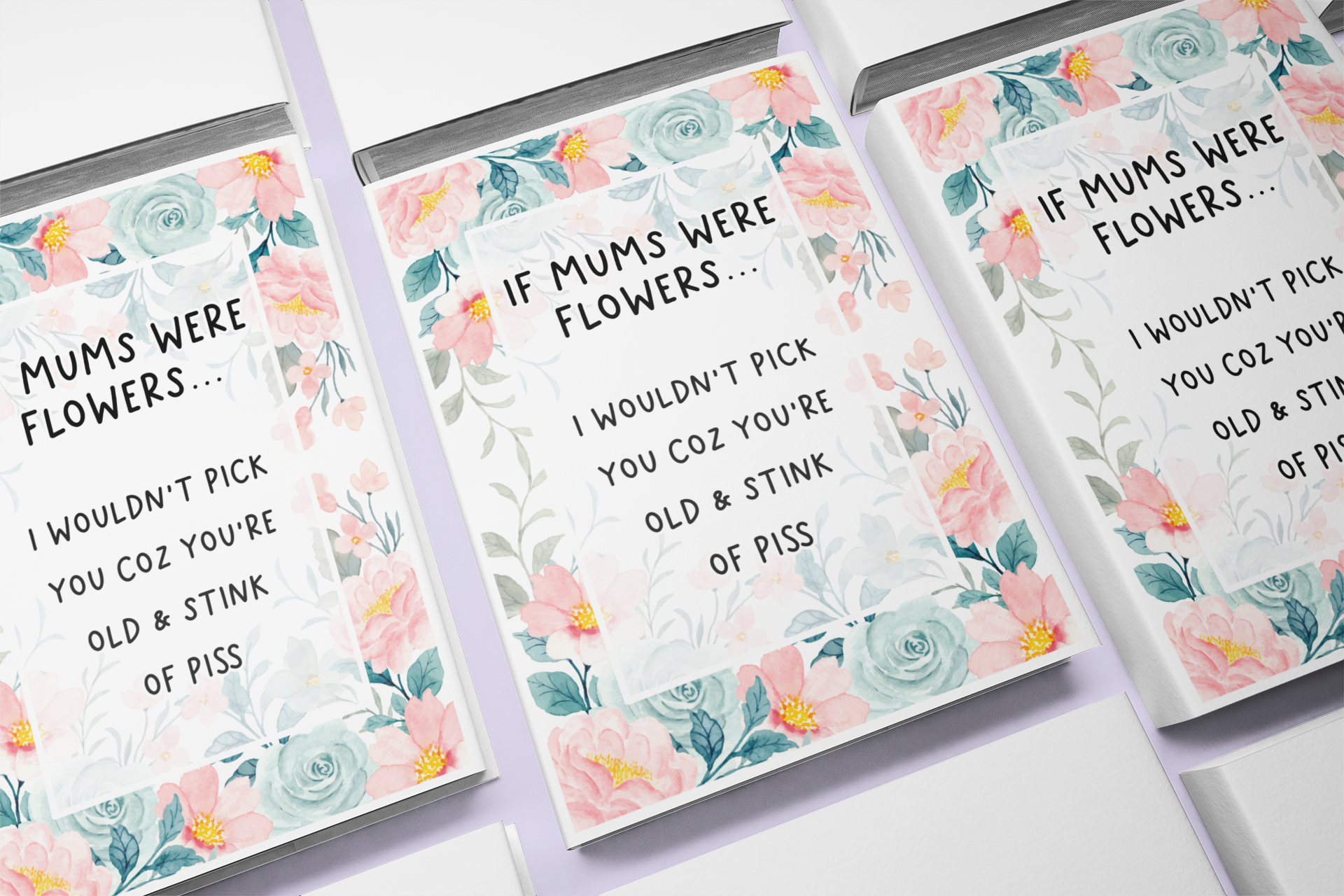 Notebook with a pastel colour floral design to the front with the quote 'if mums were flowers... i wouldn't pick you coz you're old & stink of piss' printed in the middle in black ink.
