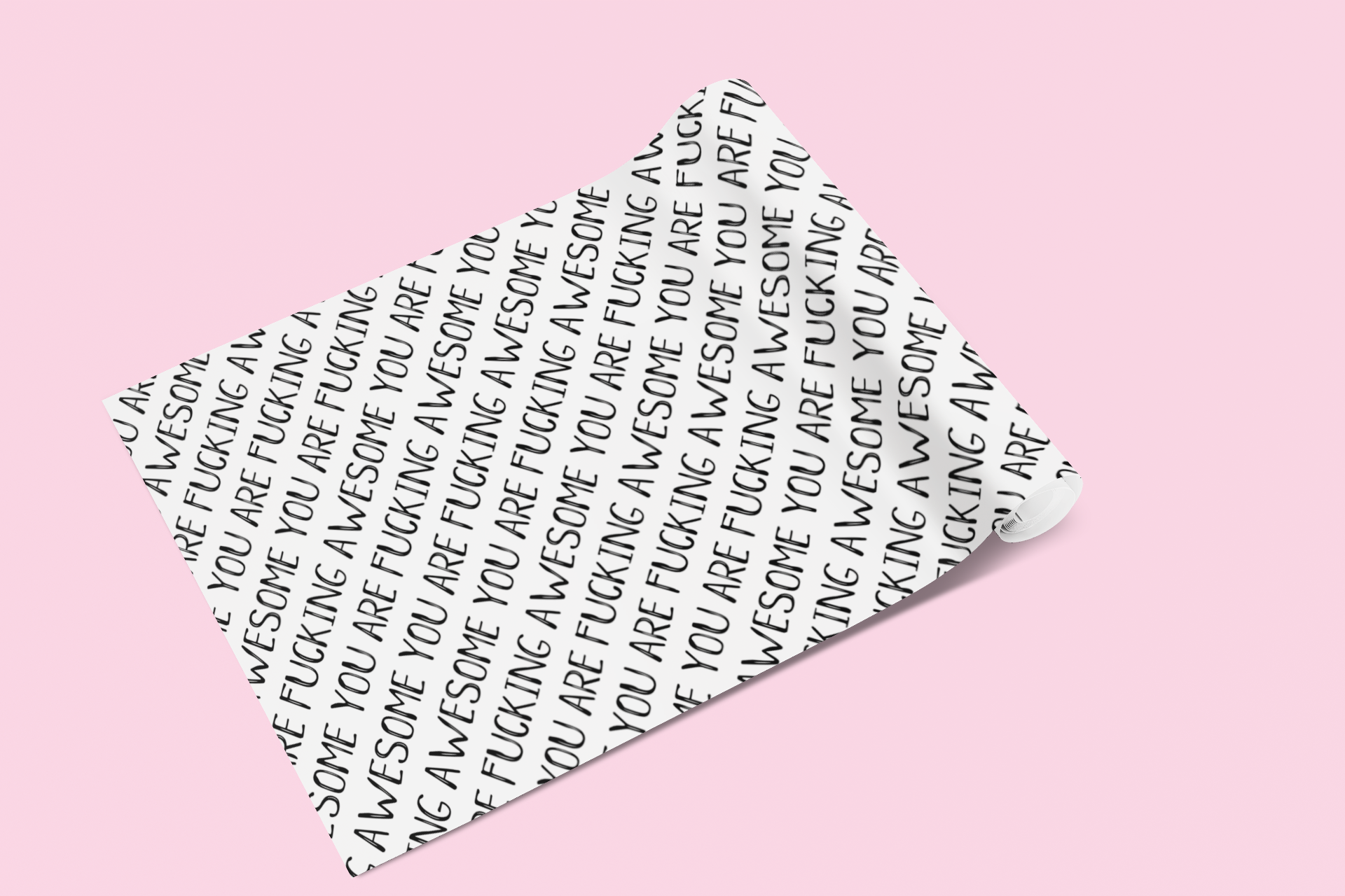 A roll of gift wrap laid out on to a pink surface. Features a funny repetitive quote 'you are fucking awesome' in black ink.