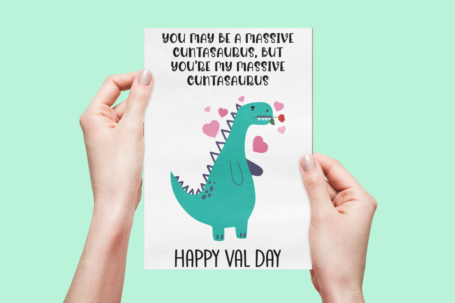 A5 glossy white card with a valentines dinosaur design to the front. The quote reads 'you may be a massive cuntasaurus, but you're my massive cuntasaurus'. With happy val day situated at the bottom. The inside is left blank.