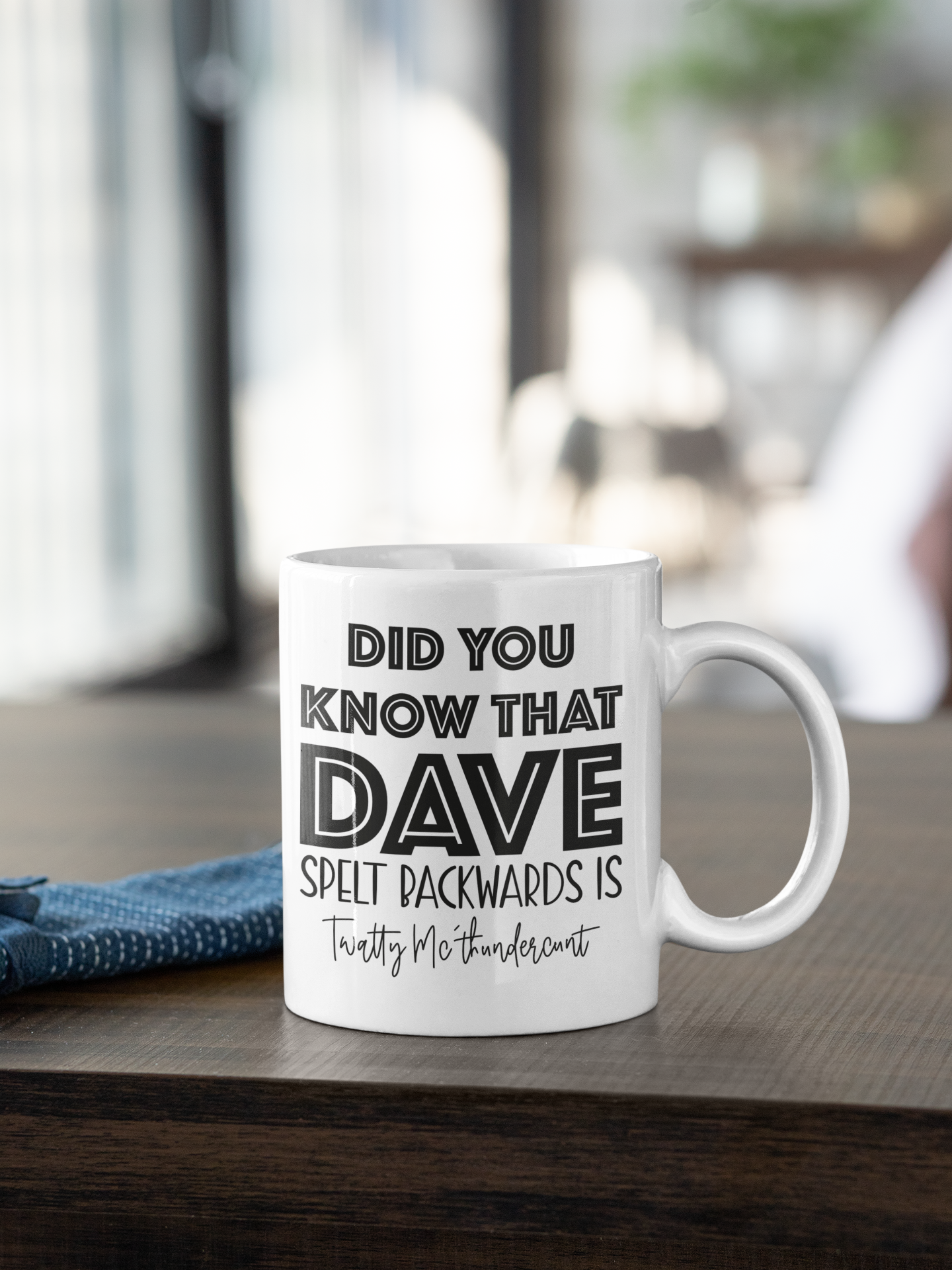 White mug with the quote did you know that dave spelt backwards is twatty mcthundercunt. Printed in black ink.