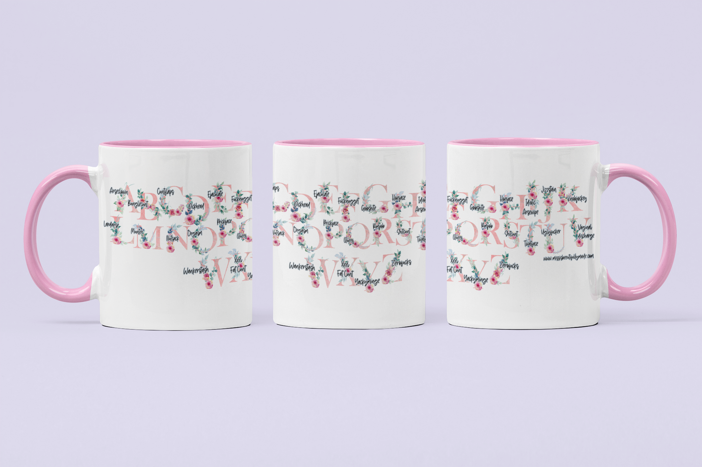 A white ceramic mug featuring a pink floral alphabet design around the whole of the mug. Each letter has a funny profanity word associated to it i.e, a for arseclown, b for bunglecunt.