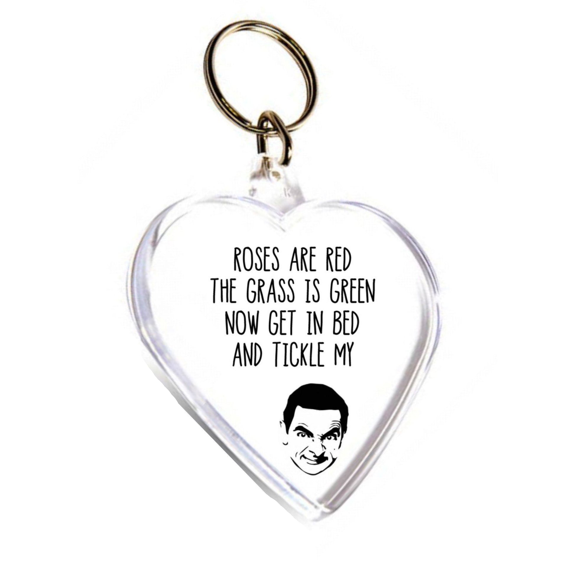 Acrylic heart shape key ring featuring a silhouette of Mr Bean. To the top it reads 'roses are red, the grass is green, get in bed & tickle my...'. Printed in black ink.