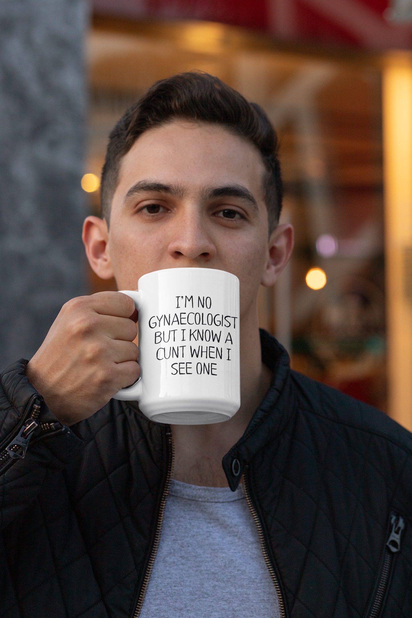 White mug featuring the funny quote i'm no gynaecologist but i know a c*nt when i see one. Printed in black ink.