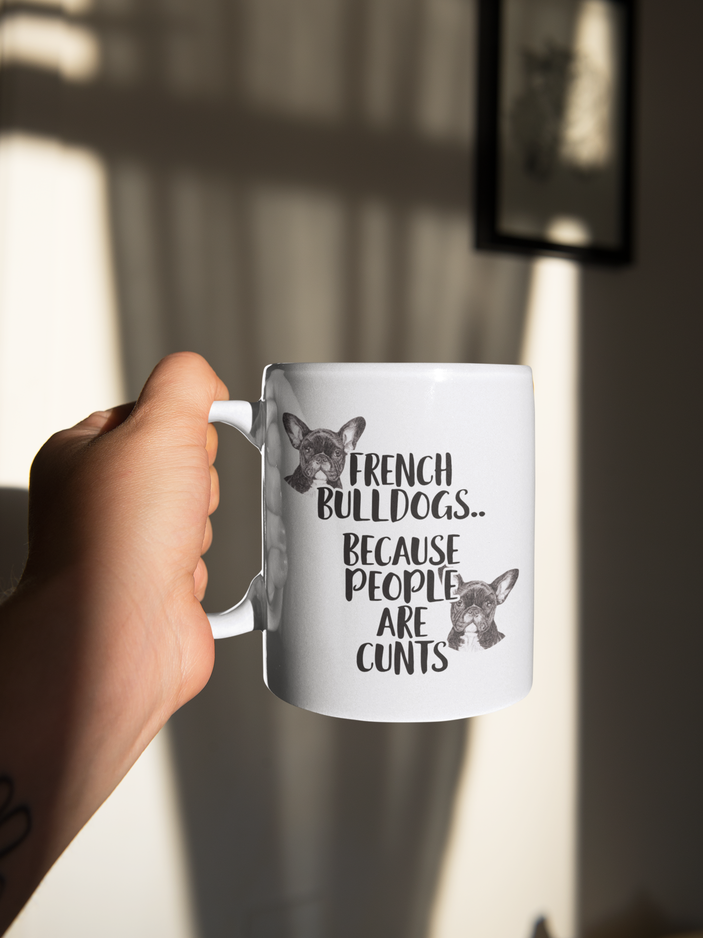 White mug with the words french bulldogs.. because people are c*nts. To the top left and bottom write of the wording are two sketches french bulldogs.
