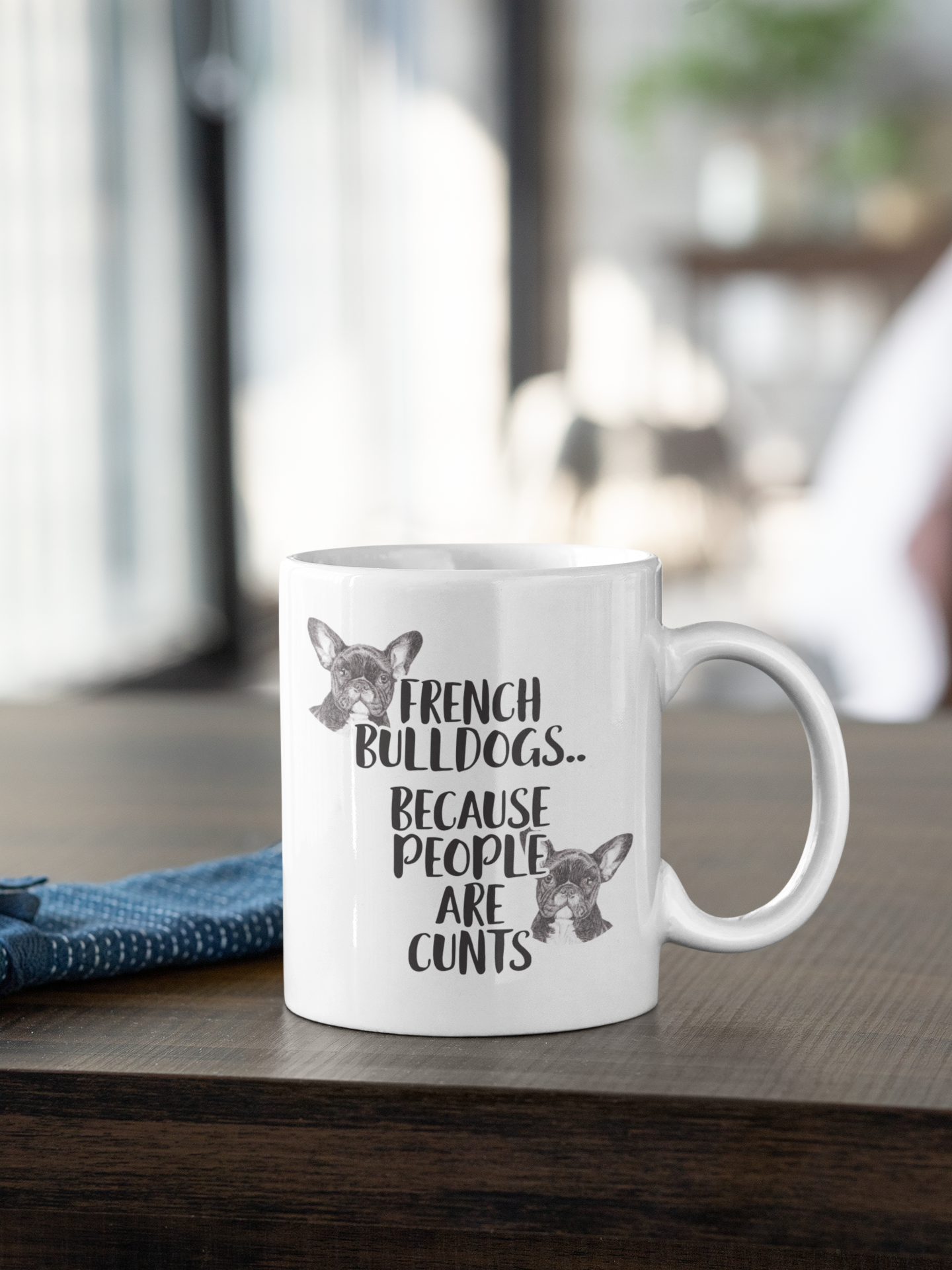 White mug with the words french bulldogs.. because people are c*nts. To the top left and bottom write of the wording are two sketches french bulldogs.