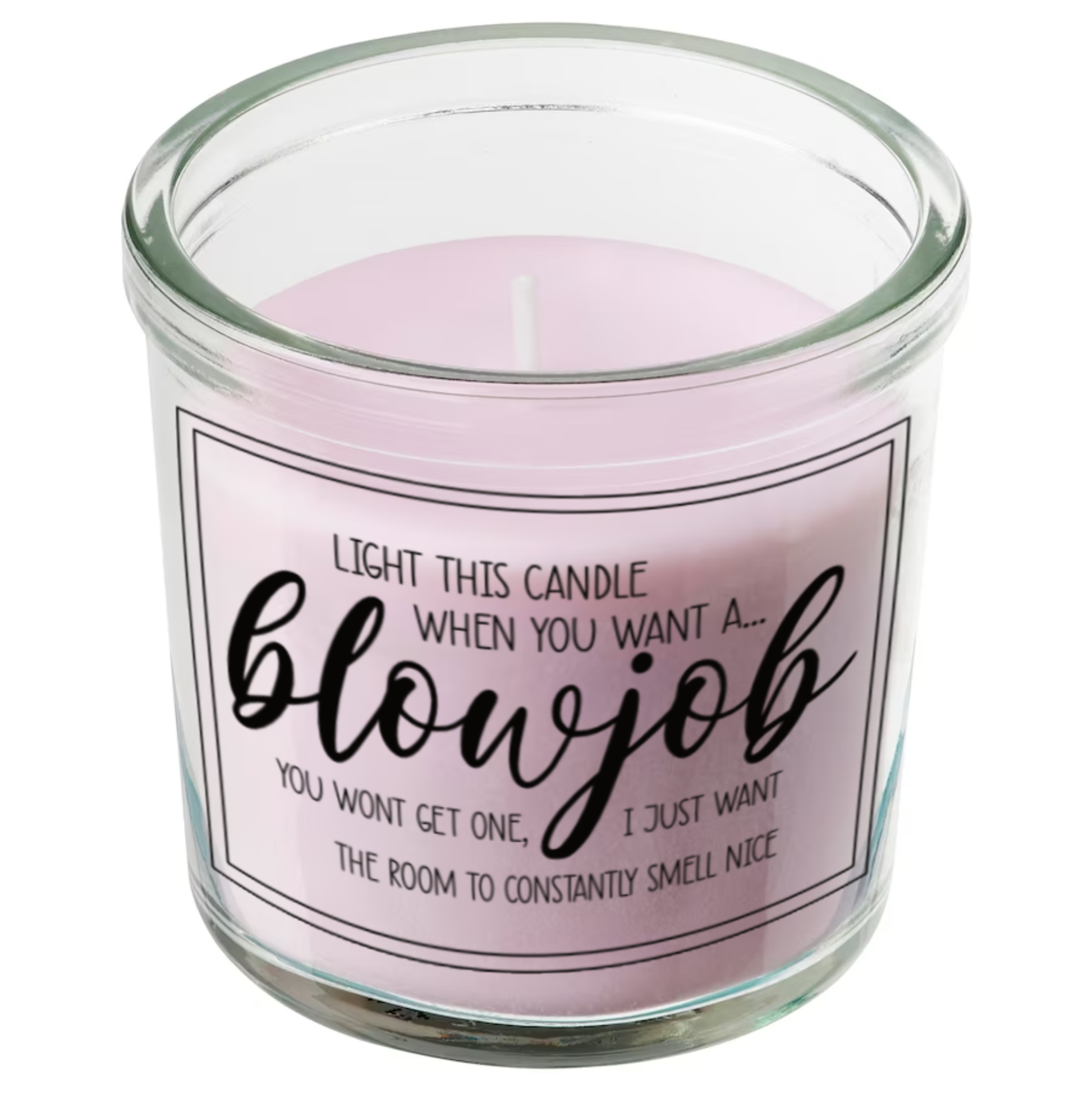 Glass jar candle with pink wax. Clear label to the front features a funny quote which reads 'light this candle when you want a blowjob. You won't get one, i just want the room to constantly smell nice'. 