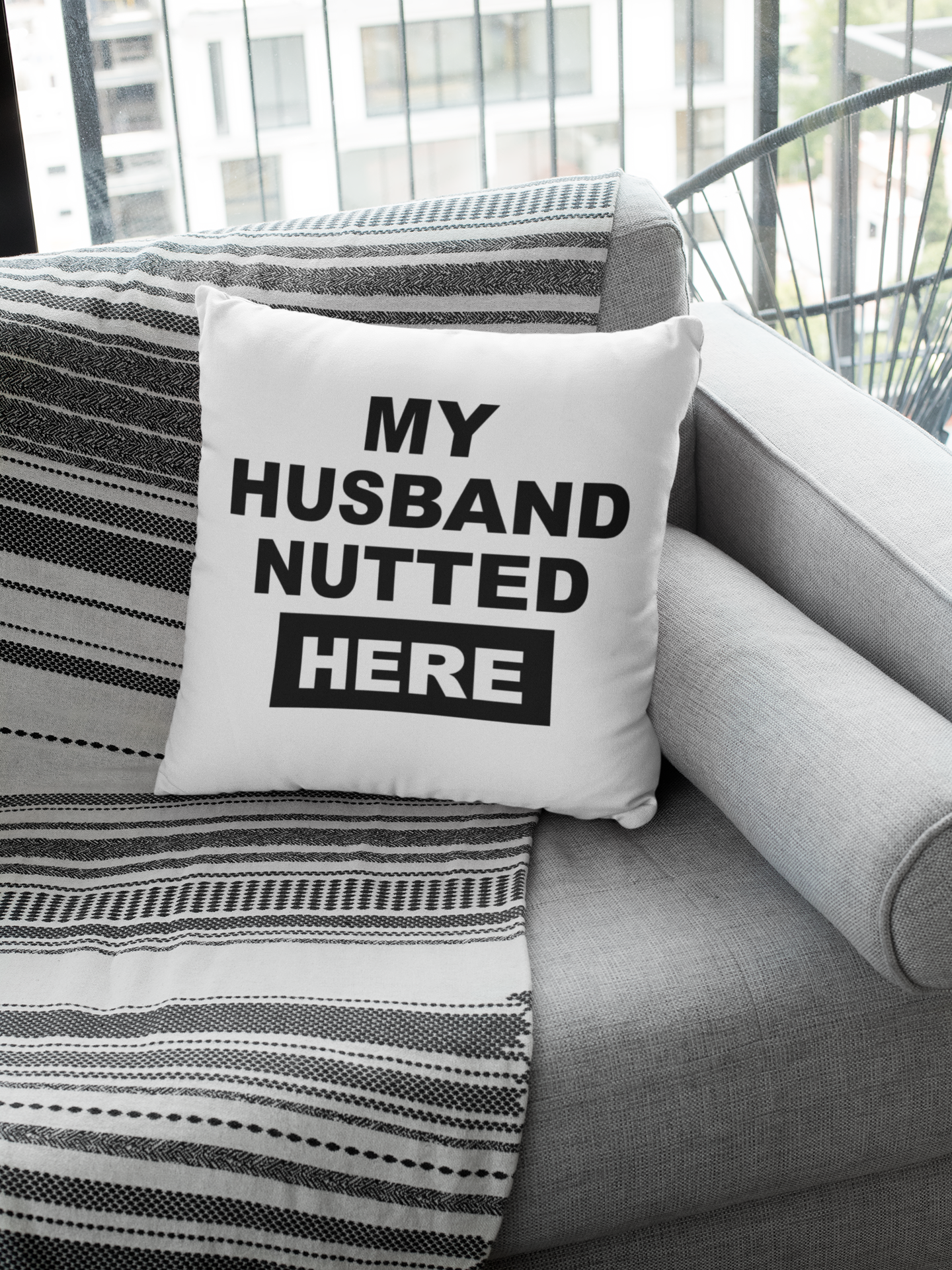 White cushion cover with the funny quote 'my husband nutted here'. Cover only, Zip fastener and printed one side