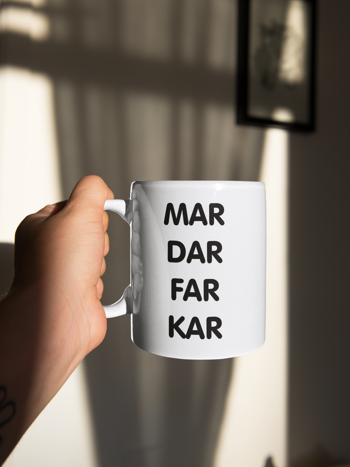 White mug featuring a bold quote to the middle which reads mar dar far kar. Printed in black ink.