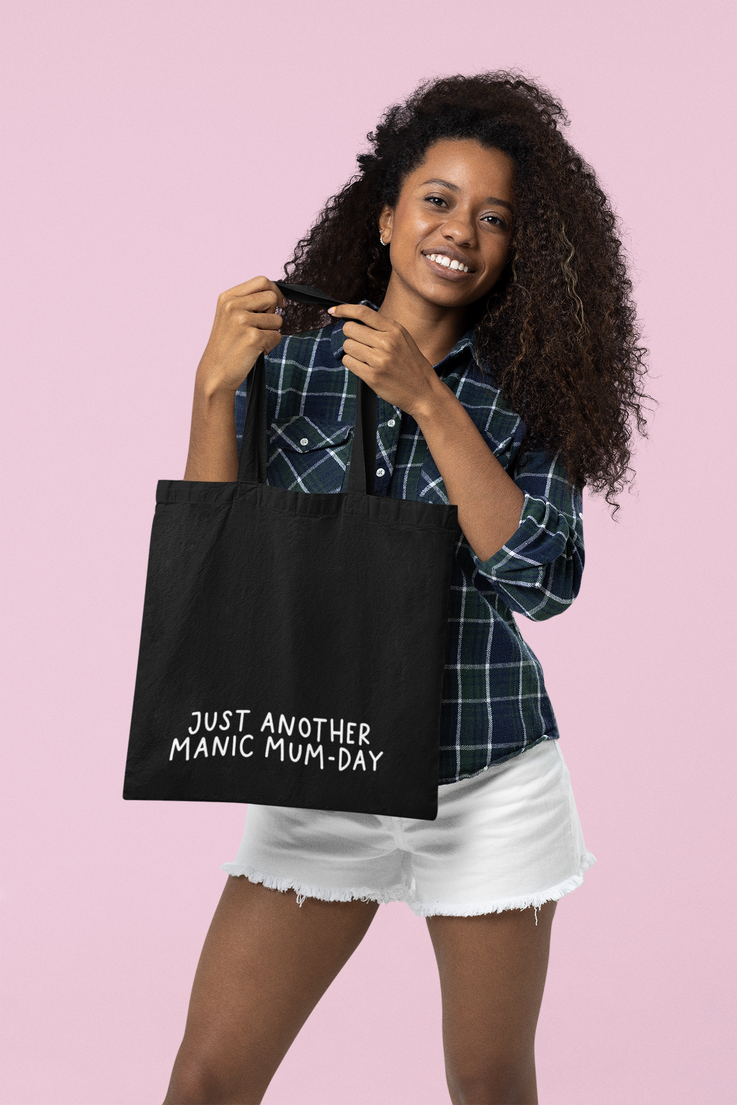 Black cotton tote bag with a quote to the bottom whoch reads 'just another manic mum-day' in white lettering.