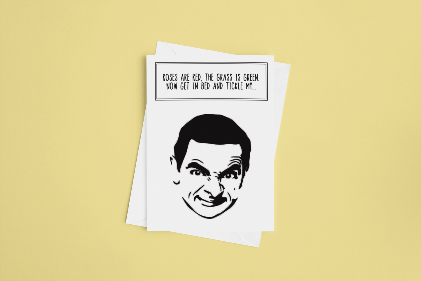 A white vertical greetings card featuring a silhouette of Mr Bean. To the top it reads 'roses are red, the grass is green, get in bed & tickle my...'. Printed in black ink.